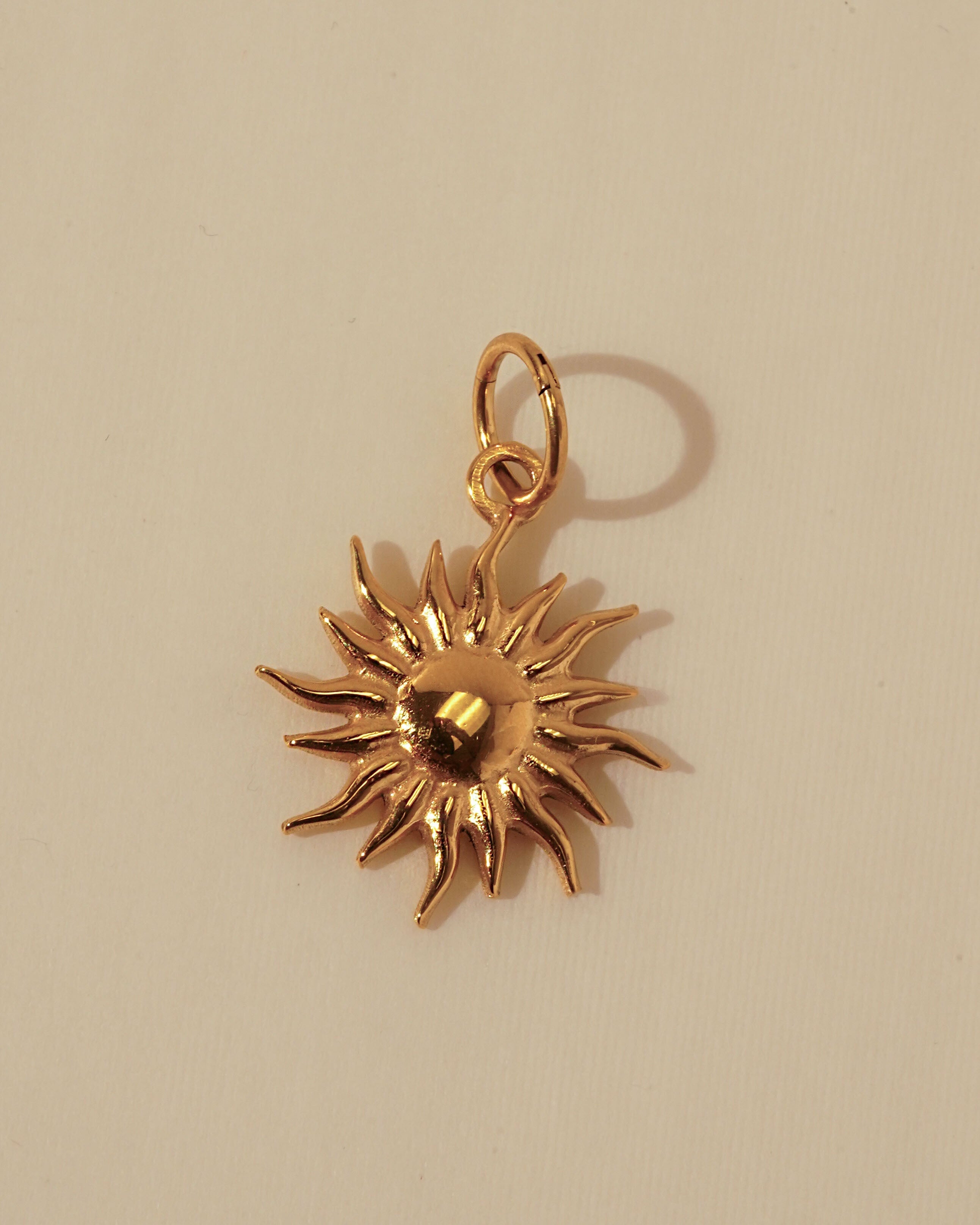 Flaming Sun Charm