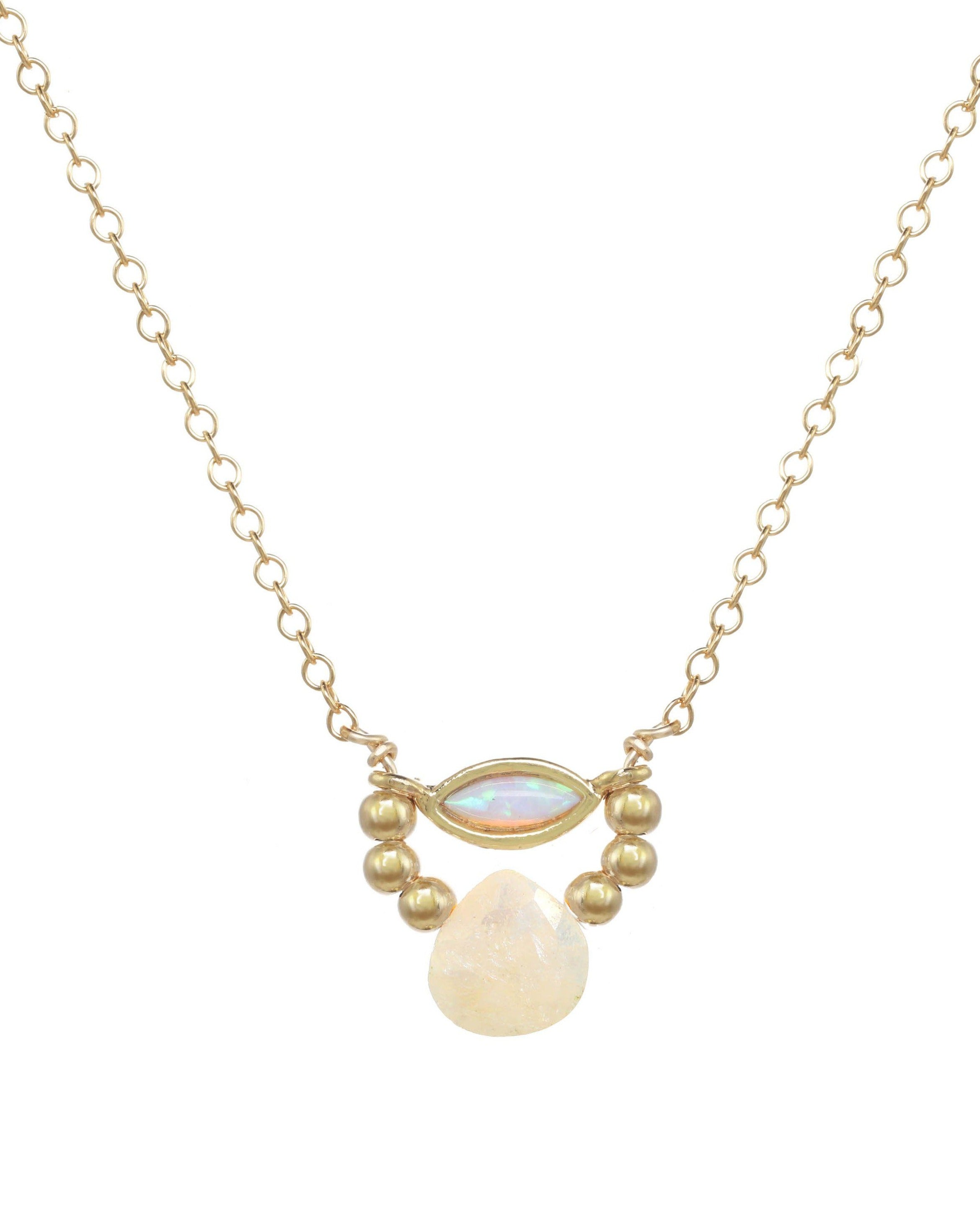 Amara Necklace by KOZAKH. A 16 to 18 inch adjustable length necklace in 14K Gold Filled, featuring a Marquise Opal charm, 2mm Gold Filled balls, and a faceted Silverite.