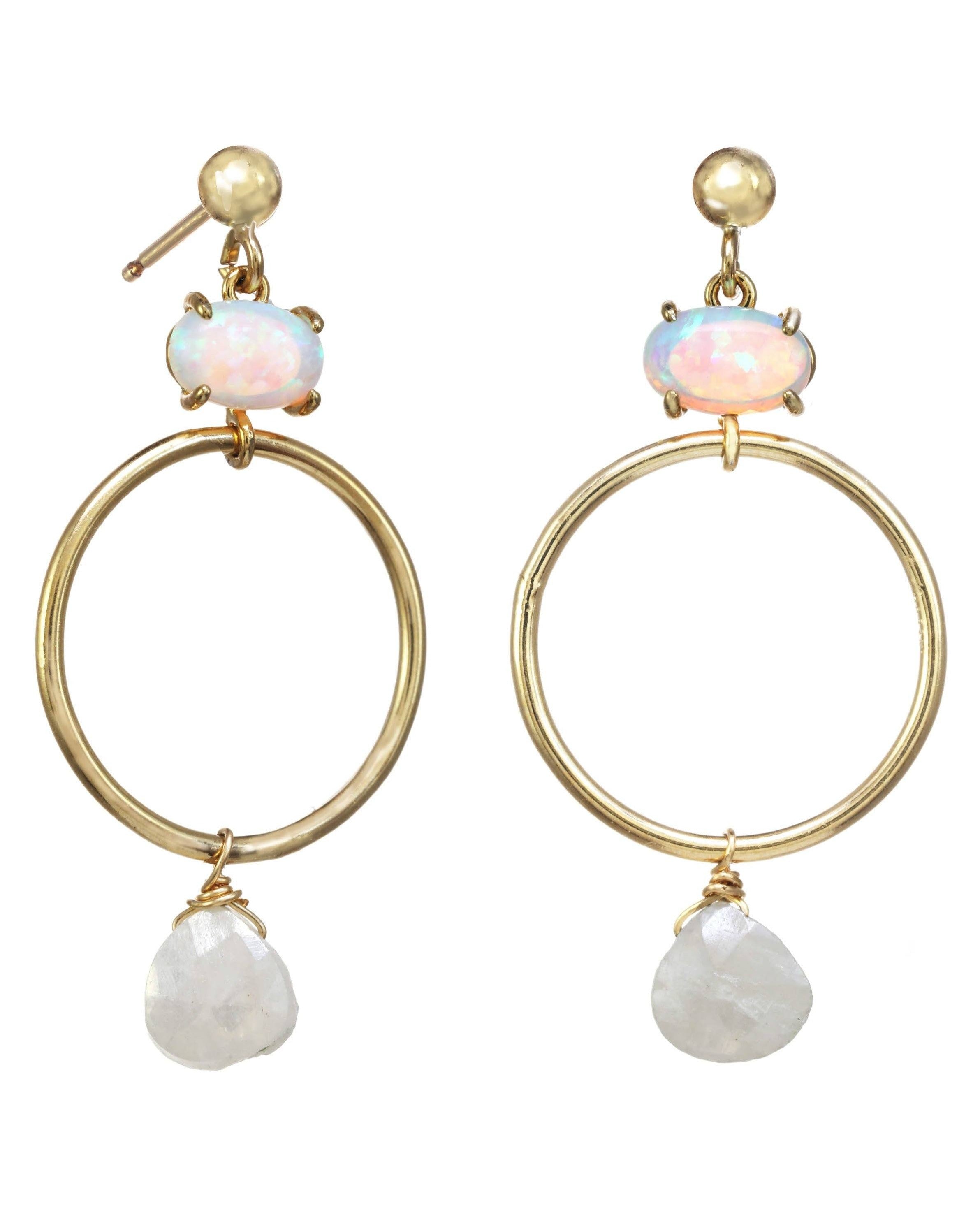 Azuu Earrings by KOZAKH. A 1 1/2 inch dangling earrings in 14K Gold Filled, featuring an Opal charm and a faceted White Sapphire.