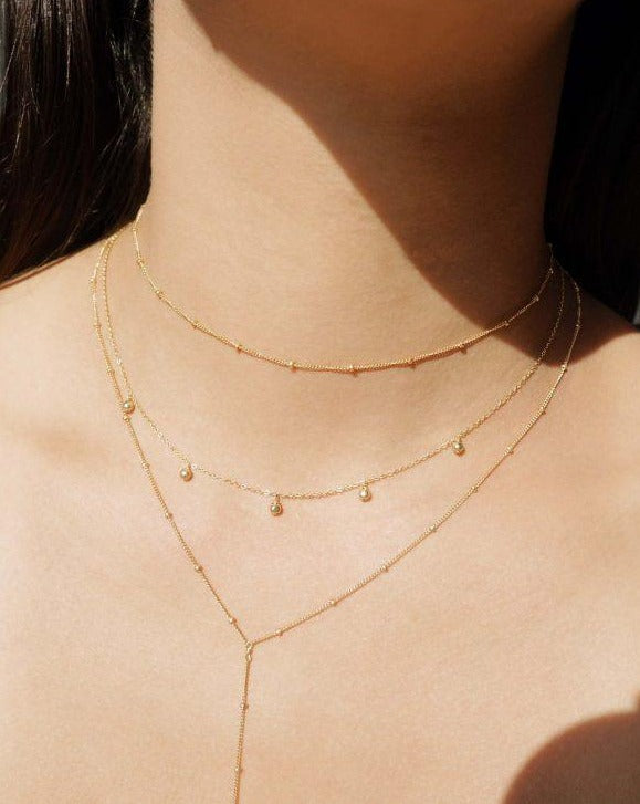 Bambita Necklace by KOZAKH. A 16 to 18 inch adjustable length necklace in 14K Gold Filled, featuring 3mm seamless gold balls.