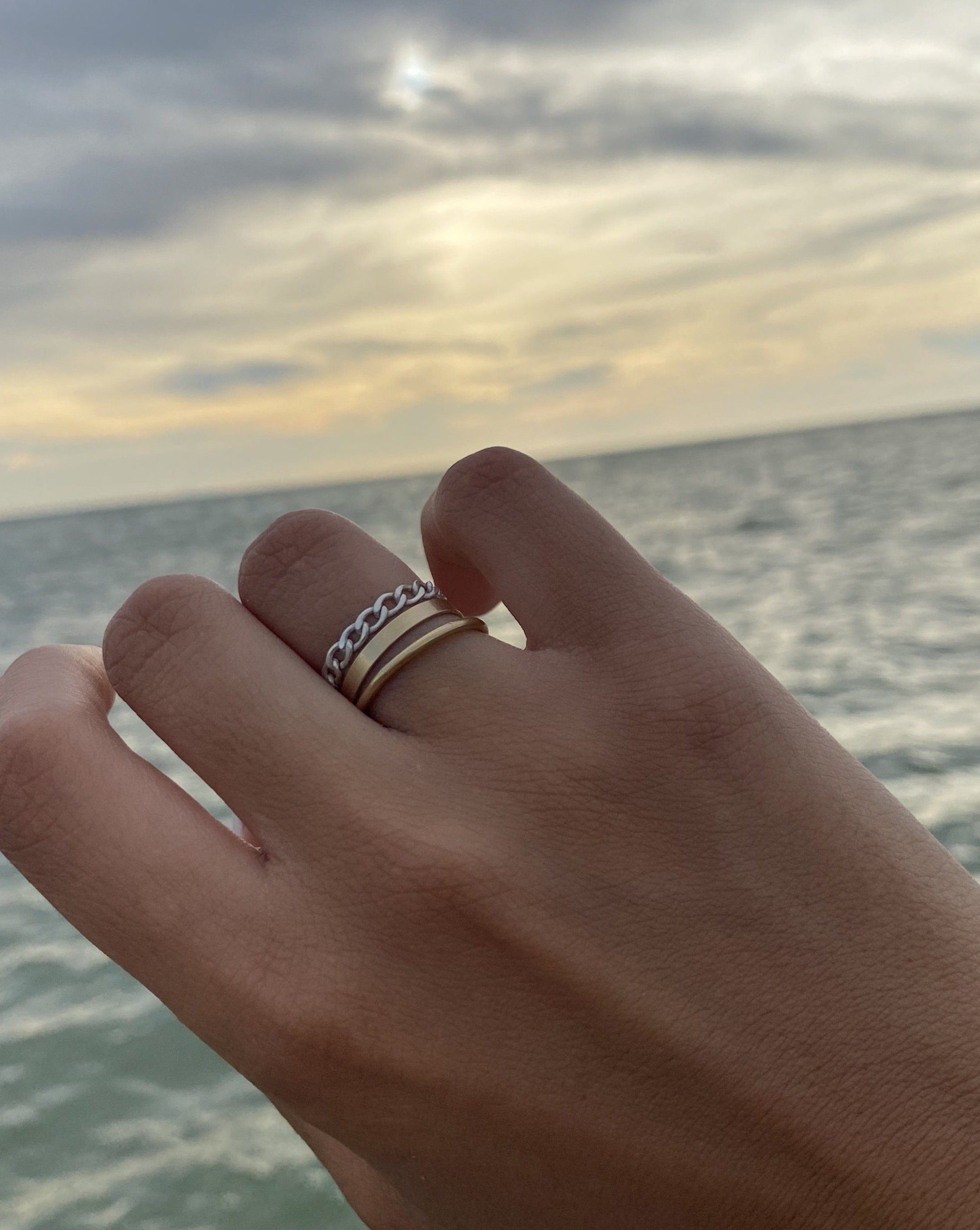 Braided Chain Ring by KOZAKH. A flat Cuban link chain ring crafted in Sterling Silver.