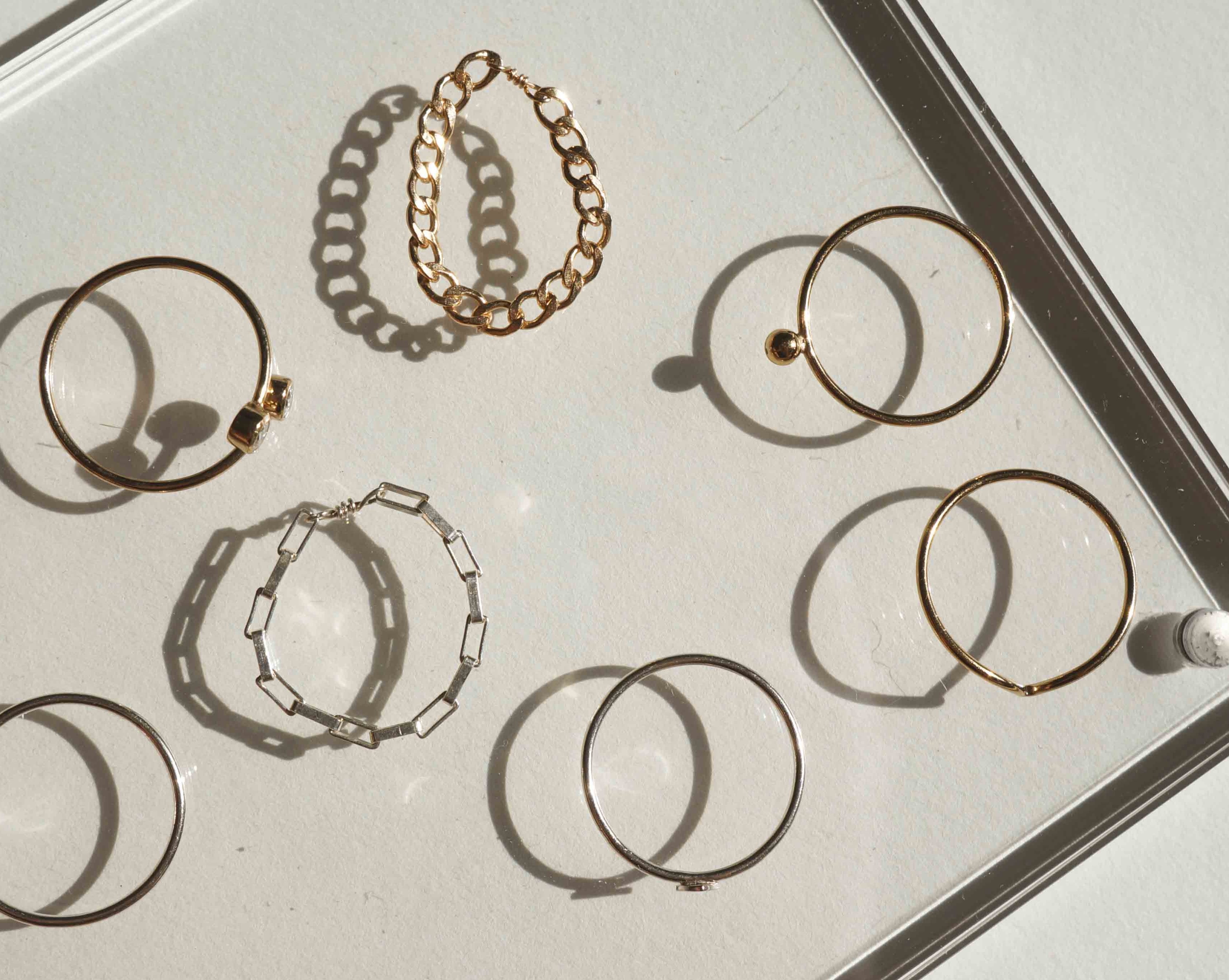 Braided Chain Ring by KOZAKH. A flat Cuban link chain ring crafted in 14K Gold Filled.