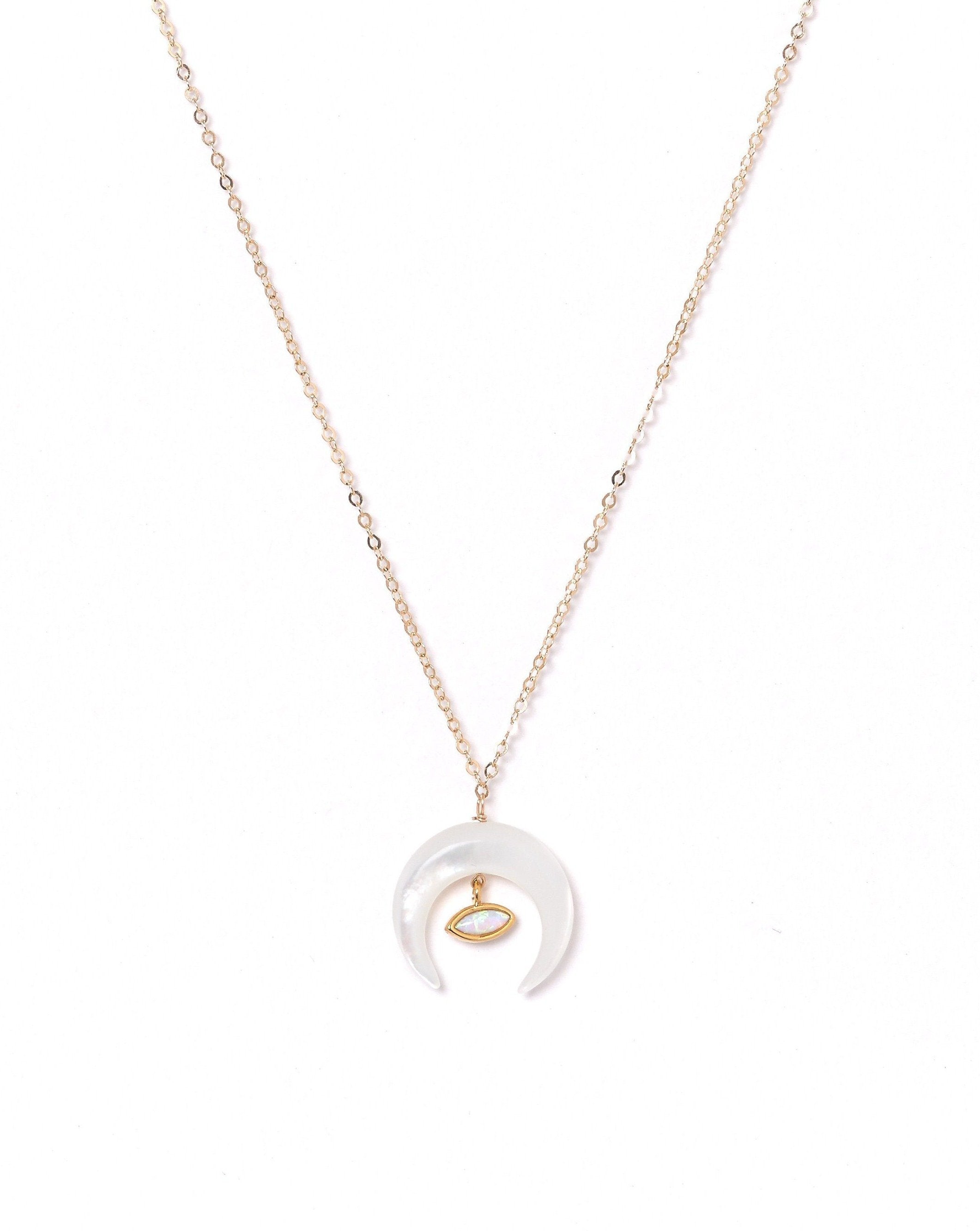 Brillar Necklace by KOZAKH. A 16 to 18 inch adjustable length necklace in 14K Gold Filled, featuring a Marquise Opal charm and a hand carved Mother of Pearl crescent moon charm.