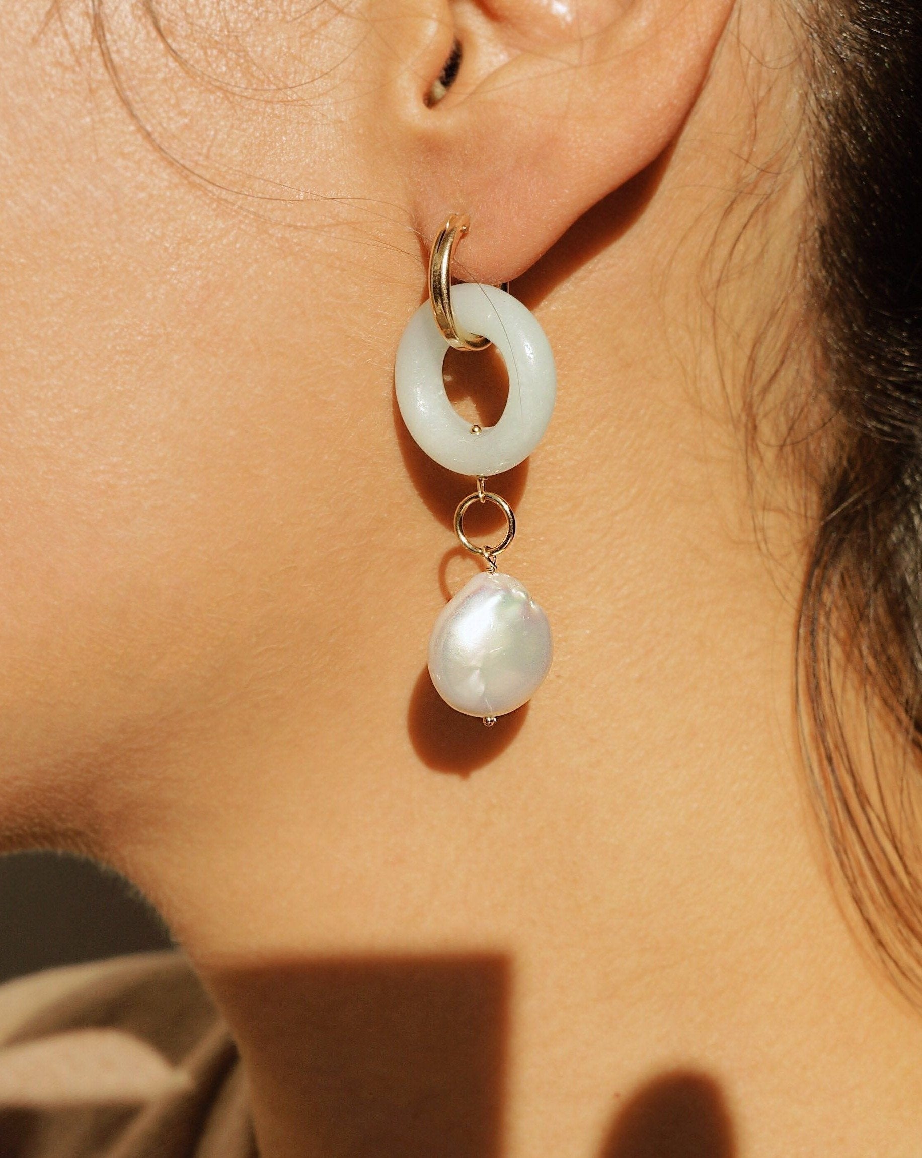 Cerceau Pearl Hoops by Kozakh. 15mm hoop dangling earrings with snap closure, crafted in 14K Gold Filled, featuring a doughnut shape Amazonite gemstone and a Baroque Pearl.