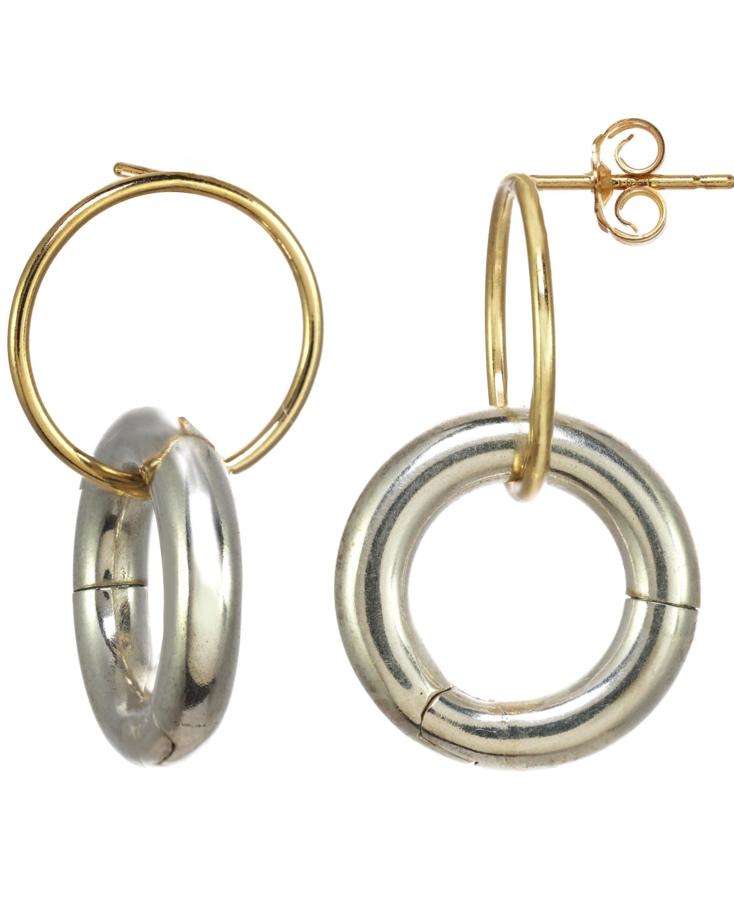Charlotte Earrings by KOZAKH. Stud earrings in 14K Gold Filled, featuring a dangling and removable silver huggies.