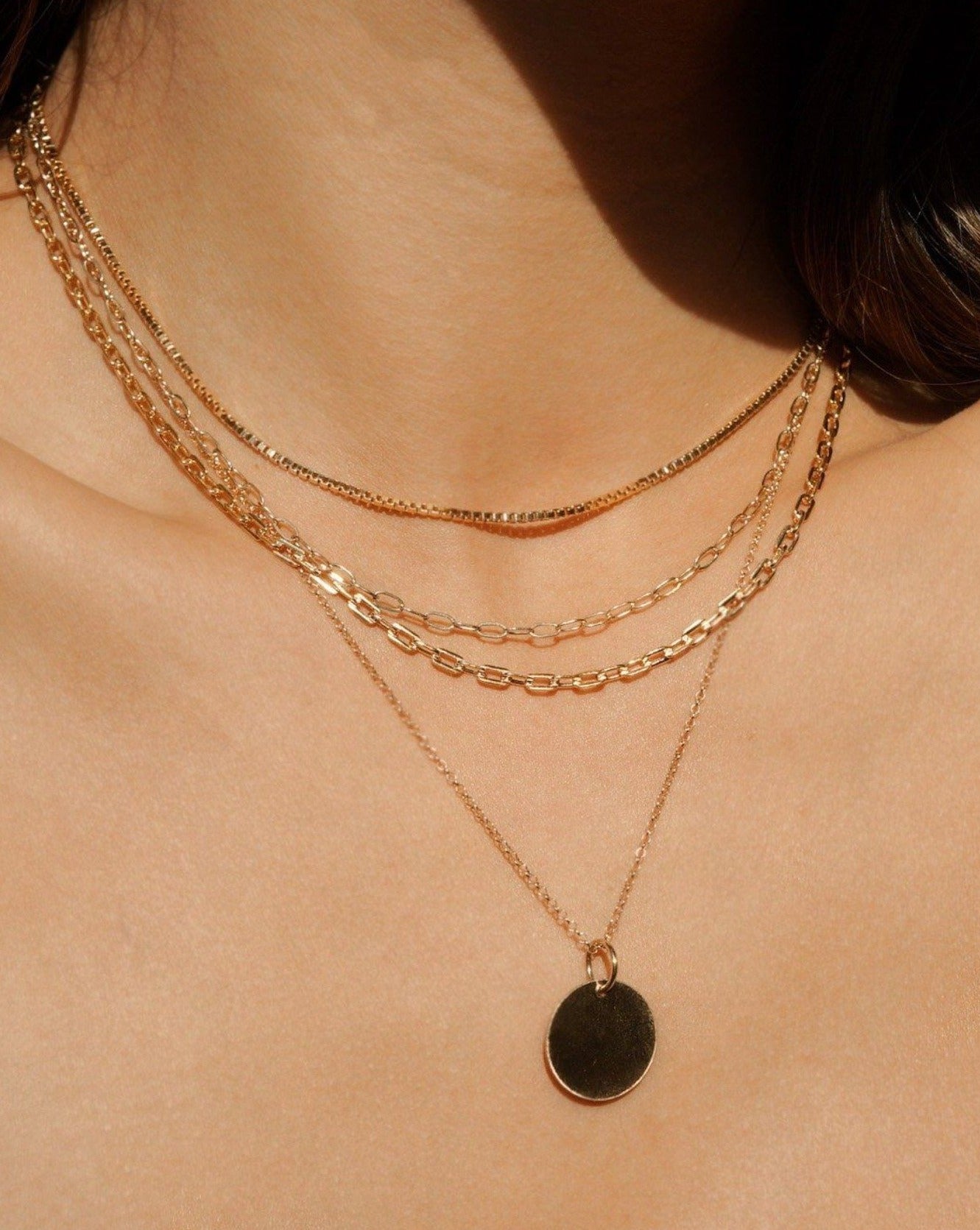 Chloe Necklace by KOZAKH. A 16 inch long Rollo chain necklace in 14K Gold Filled, featuring a 16mm Coin medallion.