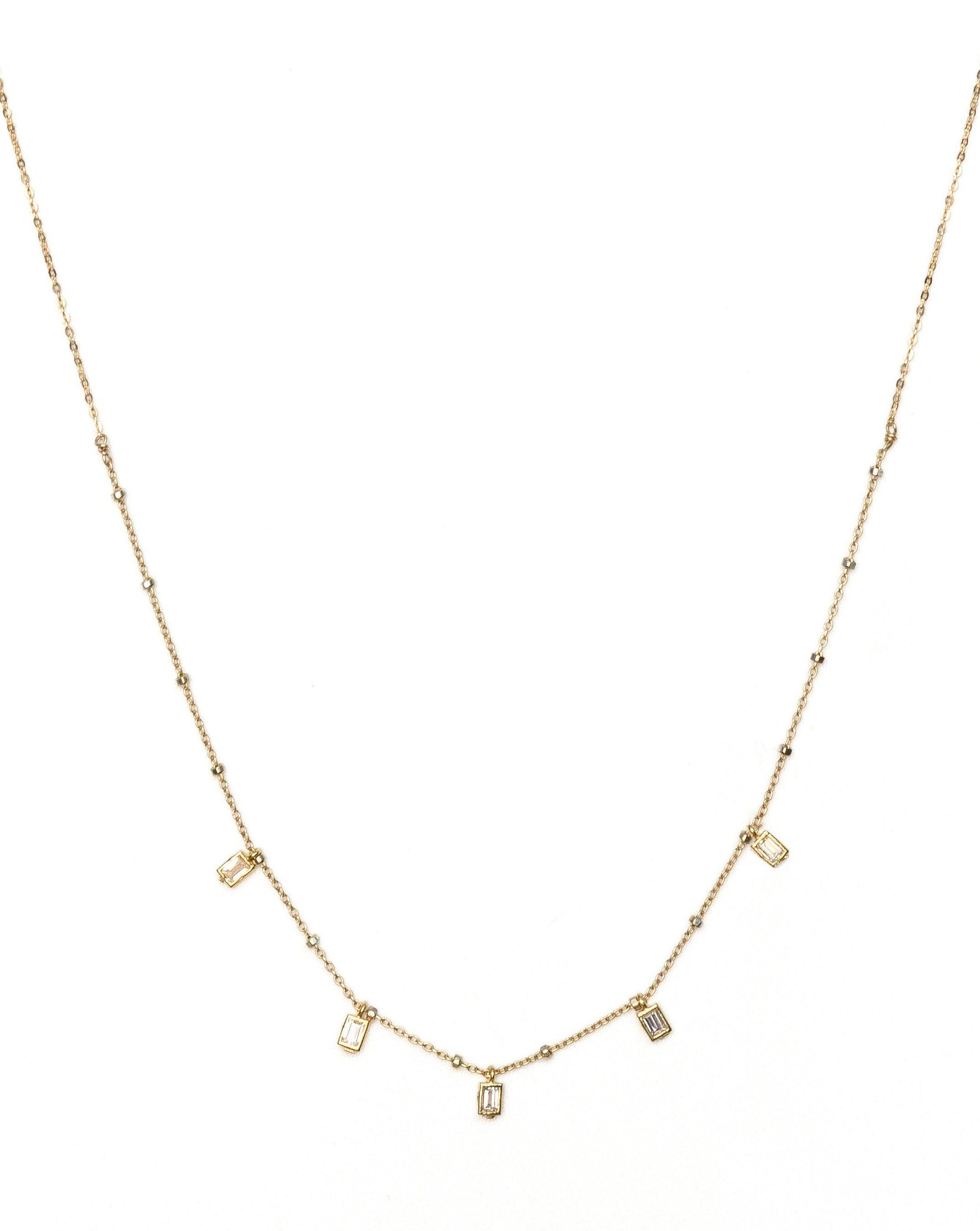 Cinco Necklace by KOZAKH. A 16 inch long necklace in 14K Gold Filled, featuring 3mm rectangular Cubic Zirconias.