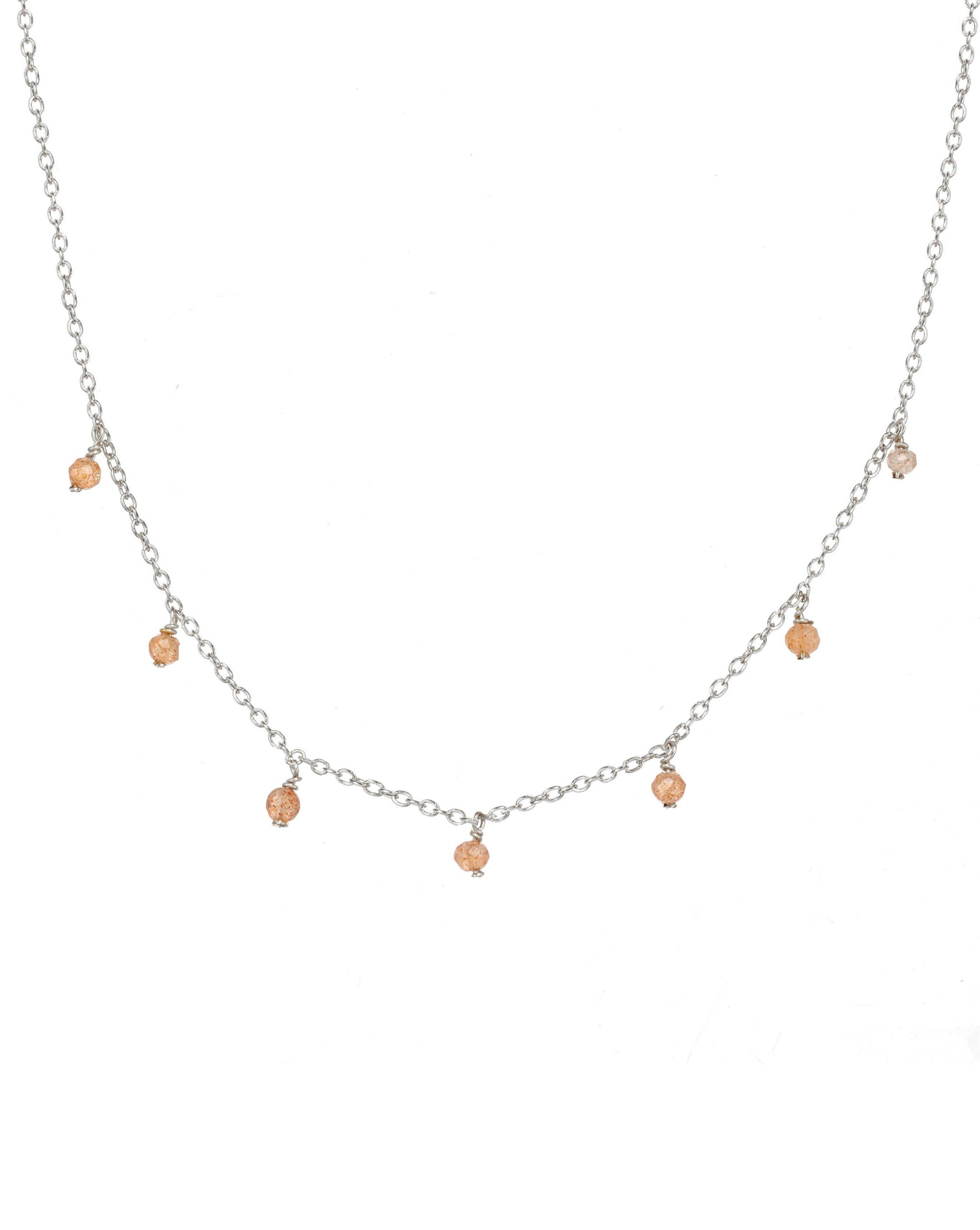 Cuy Necklace by KOZAKH. A 16 to 18 inch adjustable length necklace in Sterling Silver, featuring 2mm faceted round Peach Moonstones.