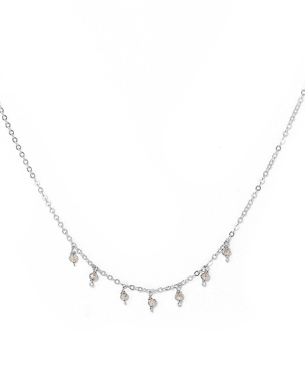 Cuy Necklace by KOZAKH. A 16 to 18 inch adjustable length necklace in Sterling Silver, featuring 2mm faceted round Tanzanite gems.