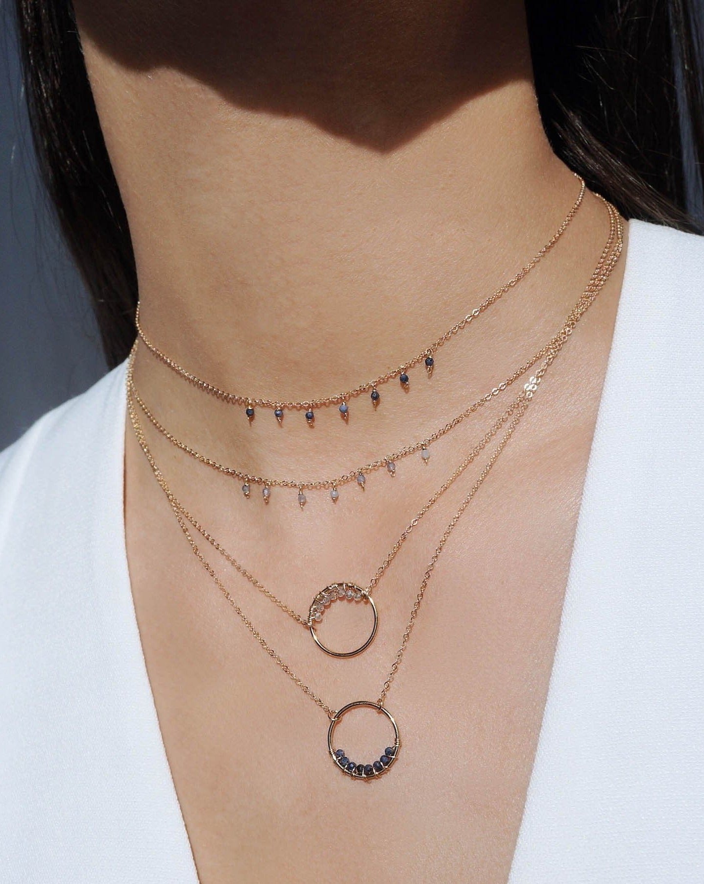 Cuy Necklace by KOZAKH. A 16 to 18 inch adjustable length necklace in 14K Gold Filled, featuring 2mm faceted round Sapphire gems.