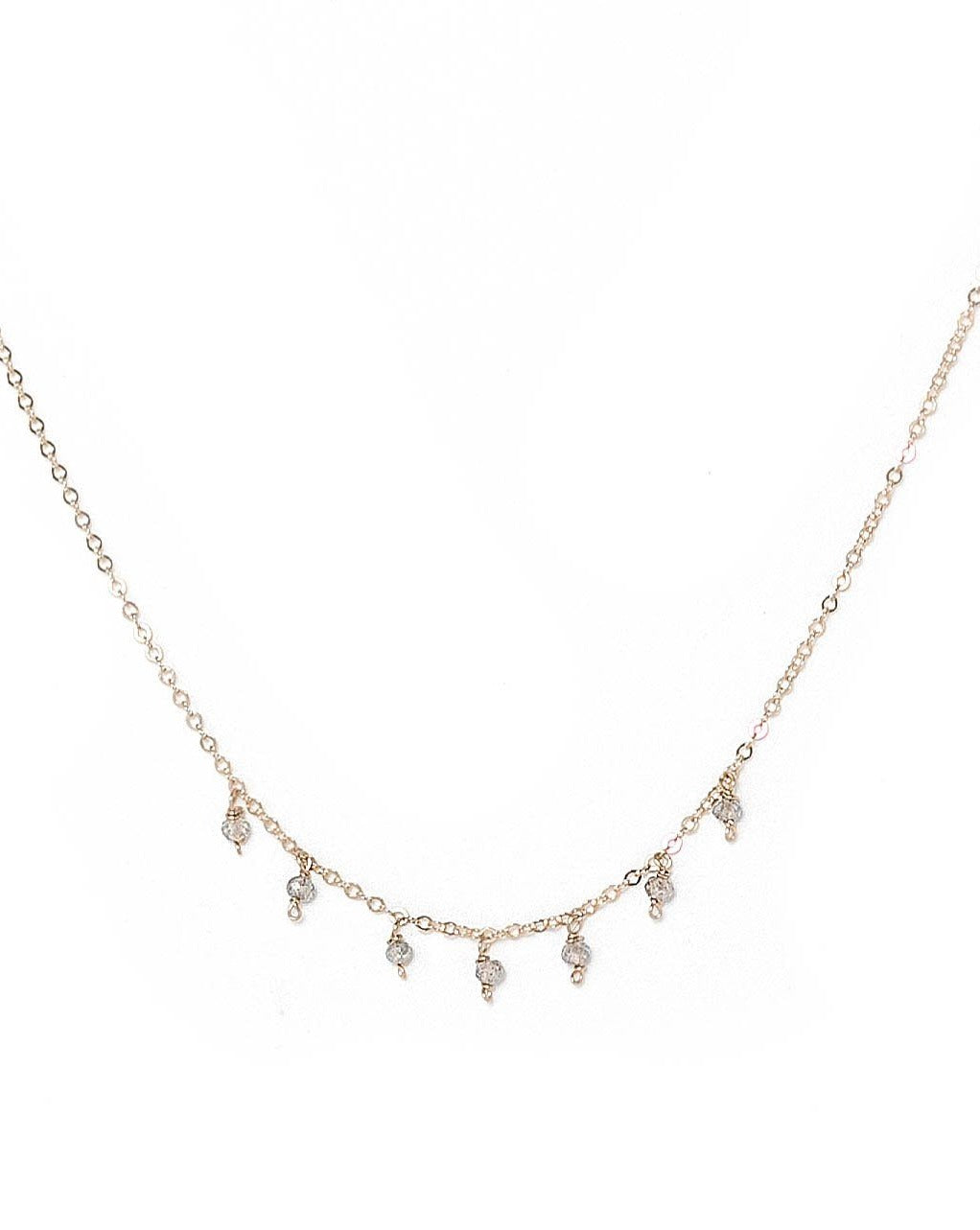 Cuy Necklace by KOZAKH. A 16 to 18 inch adjustable length necklace in 14K Gold Filled, featuring 2mm faceted round Tanzanite gems.