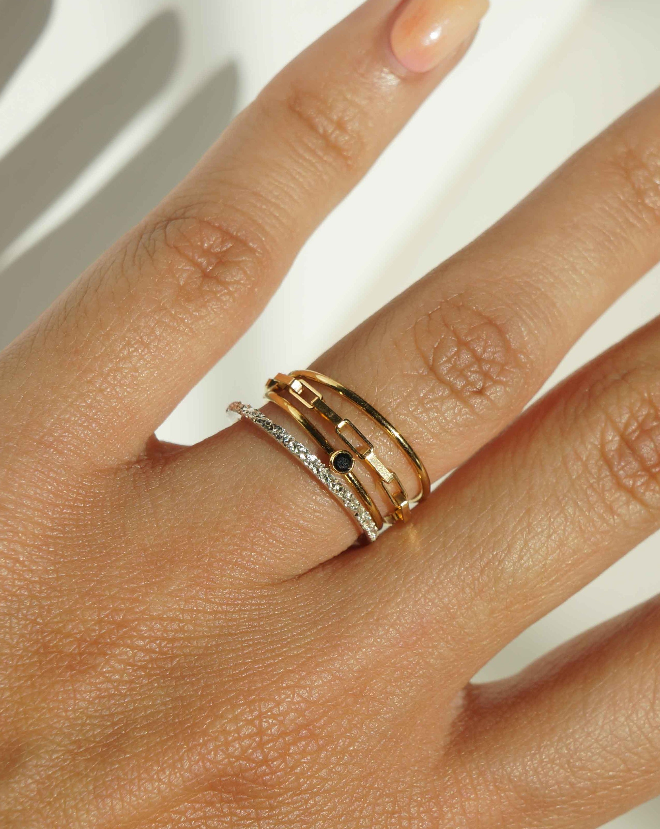 Dia Black Ring by KOZAKH. A 1mm thick ring, crafted in 14K Gold Filled, featuring a 2mm black Spinel bezel.