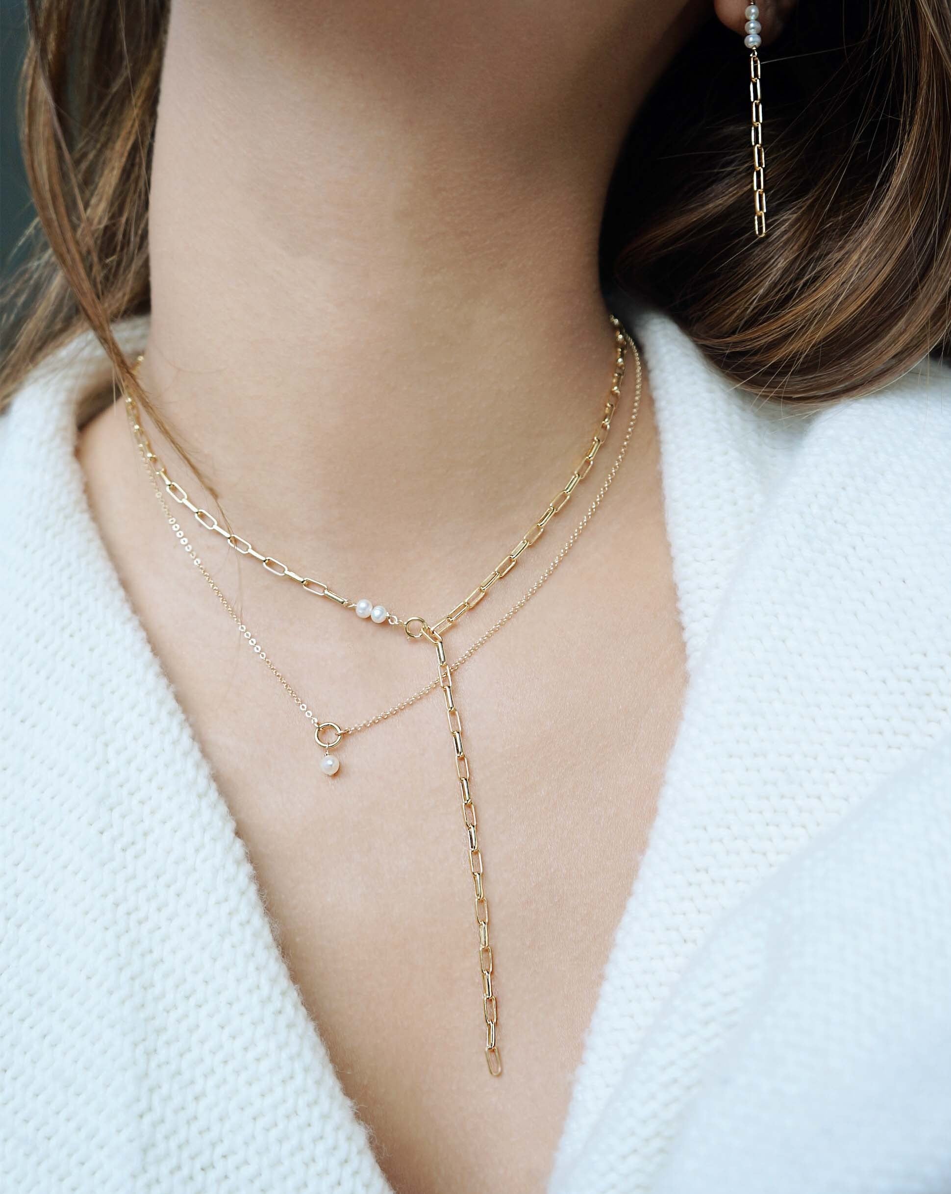 Divya Necklace by KOZAKH. A 16 to 18 inch adjustable length necklace in 14K Gold Filled, featuring a white 3-4mm pearl.