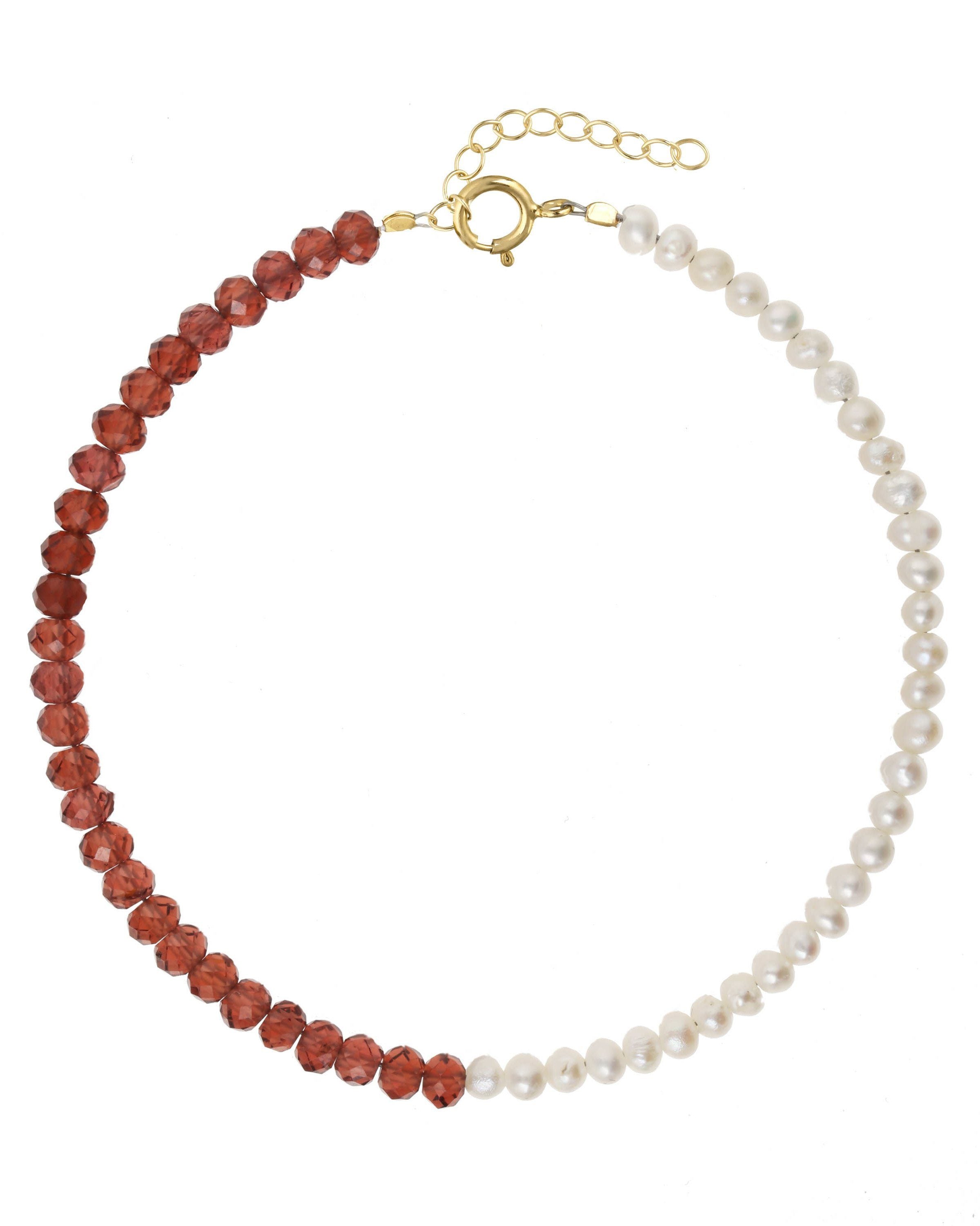 Elo Bracelet by KOZAKH. A 6 to 7 inch adjustable length bracelet, crafted in 14K Gold Filled. Half of the bracelet strand features 3.5mm Freshwater Pearls and 3.5mm Faceted Garnet beads on the other half.