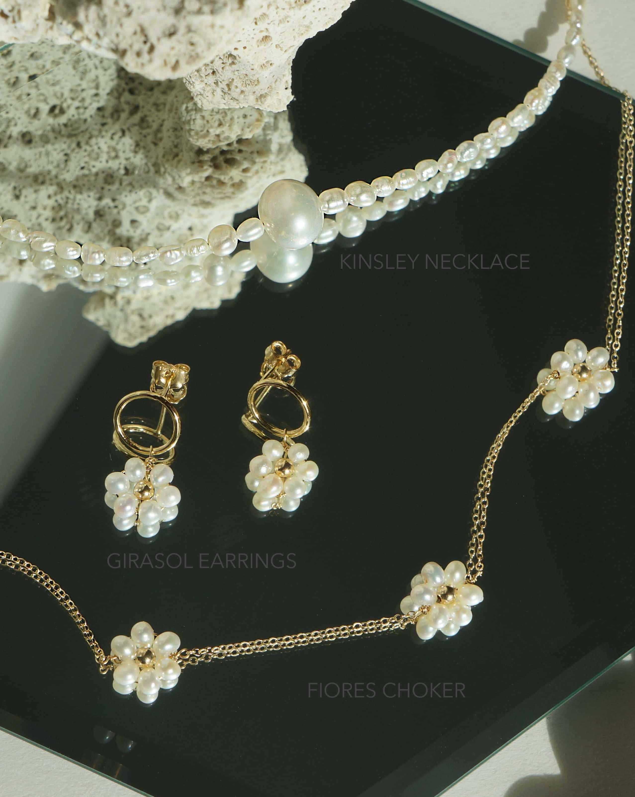 Fiores Choker Necklace by KOZAKH. A 13.5 to 15.5 inch adjustable length choker necklace, crafted in 14K Gold Filled, featuring 3mm Freshwater Pearls in form of daisies.
