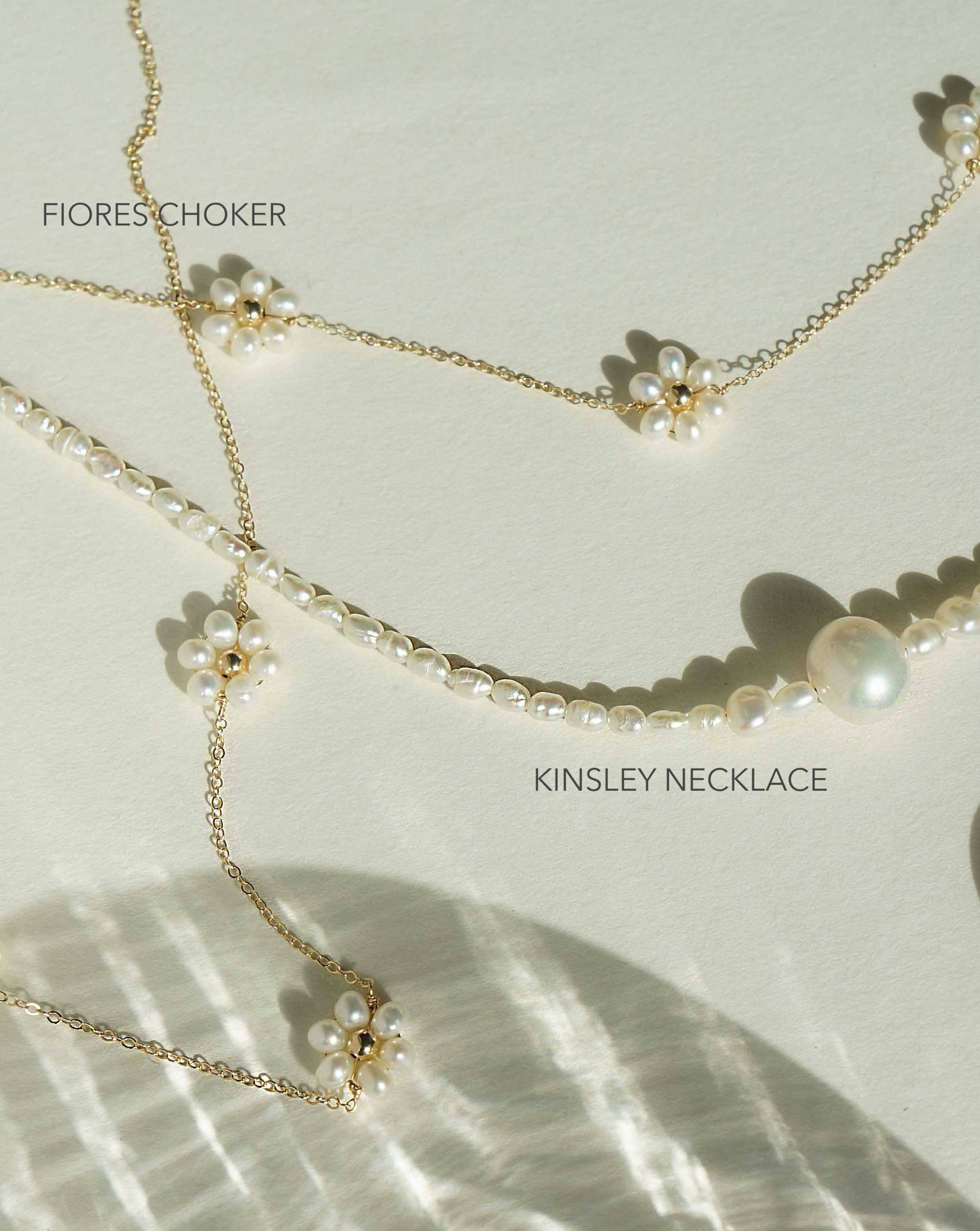 Fiores Choker Necklace by KOZAKH. A 13.5 to 15.5 inch adjustable length choker necklace, crafted in 14K Gold Filled, featuring 3mm Freshwater Pearls in form of daisies.