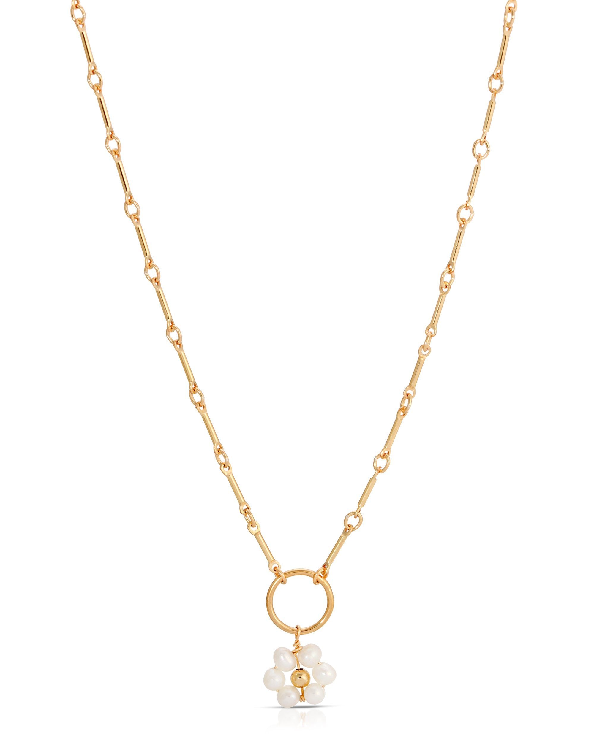 Flor Del Sol Necklace by KOZAKH. A 16 to 18 inch adjustable length necklace in 14K Gold Filled, featuring 3mm Freshwater Pearls in form of a daisy.