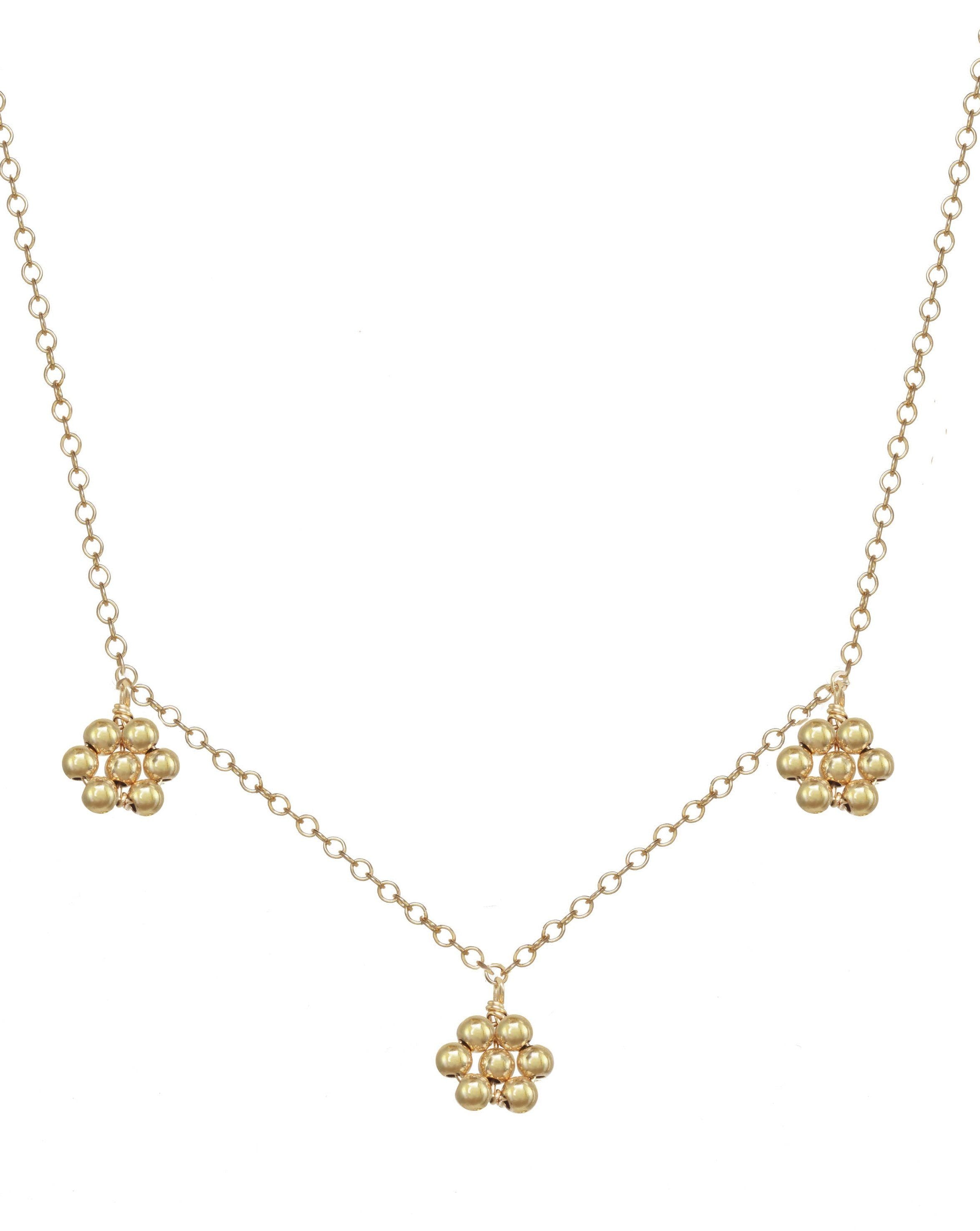 Flora Necklace by KOZAKH. A 16 to 18 inch adjustable length necklace in 14K Gold Filled, featuring handmade gold beaded daisies.