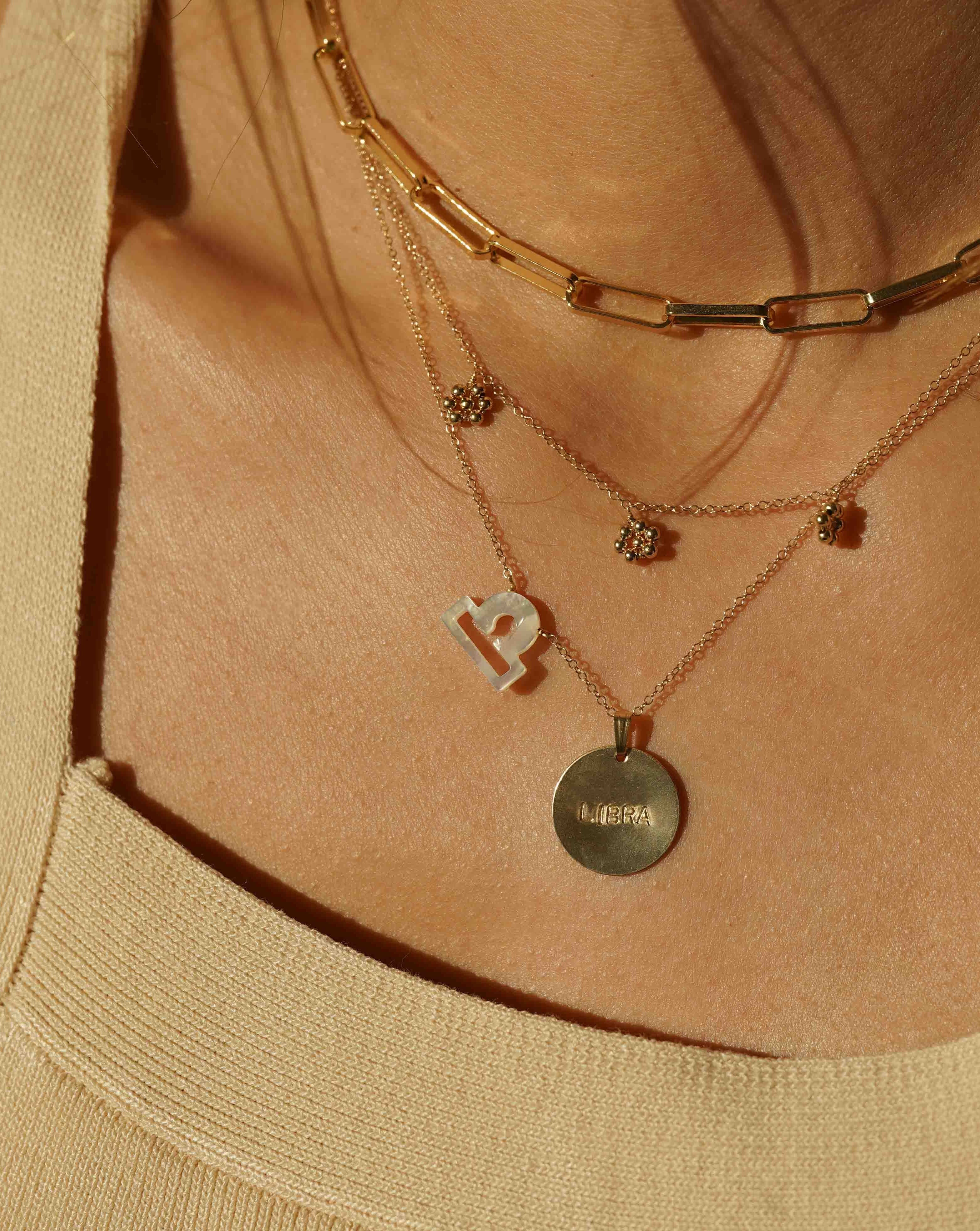 Flora Necklace by KOZAKH. A 16 to 18 inch adjustable length necklace in 14K Gold Filled, featuring handmade gold beaded daisies.