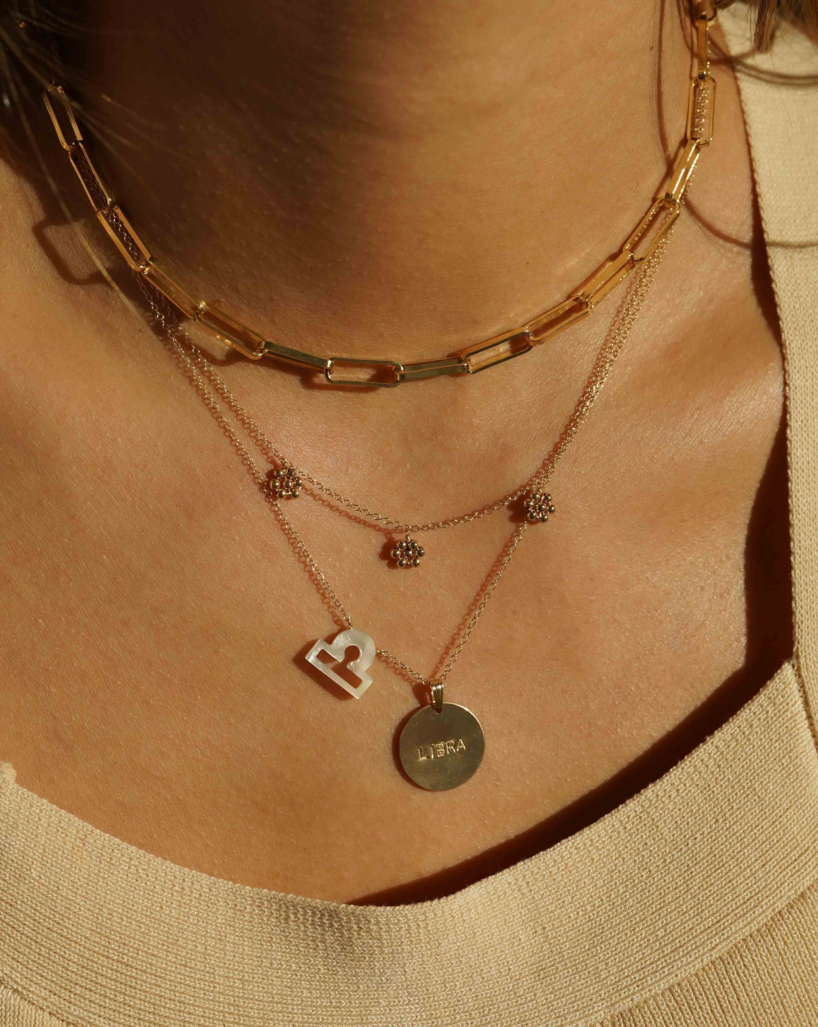 Flora Necklace by KOZAKH. A 16 to 18 inch adjustable length necklace in 14K Gold Filled, featuring handmade gold beaded daisies.