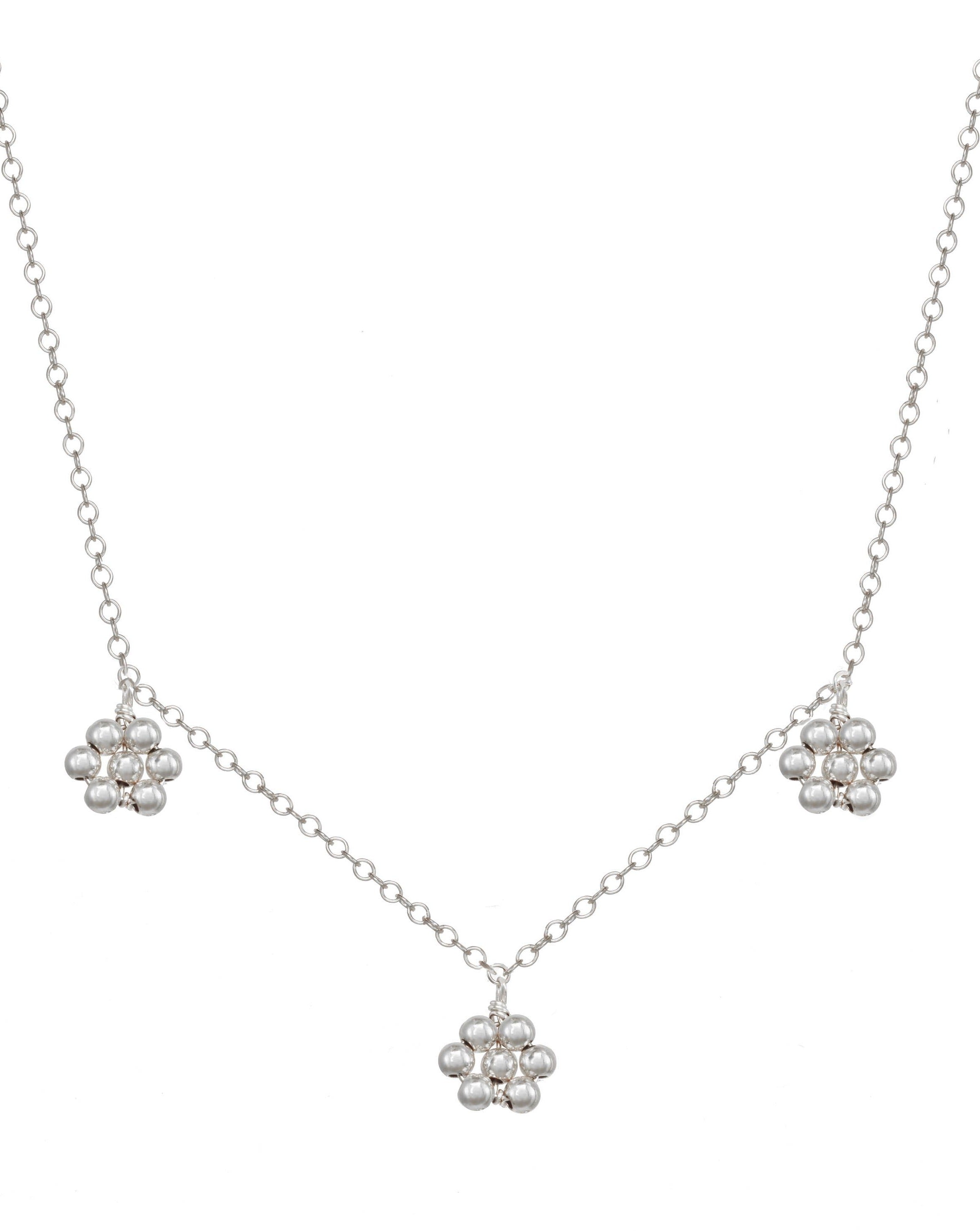 Flora Necklace by KOZAKH. A 16 to 18 inch adjustable length necklace in Sterling SIlver, featuring handmade silver beaded daisies.