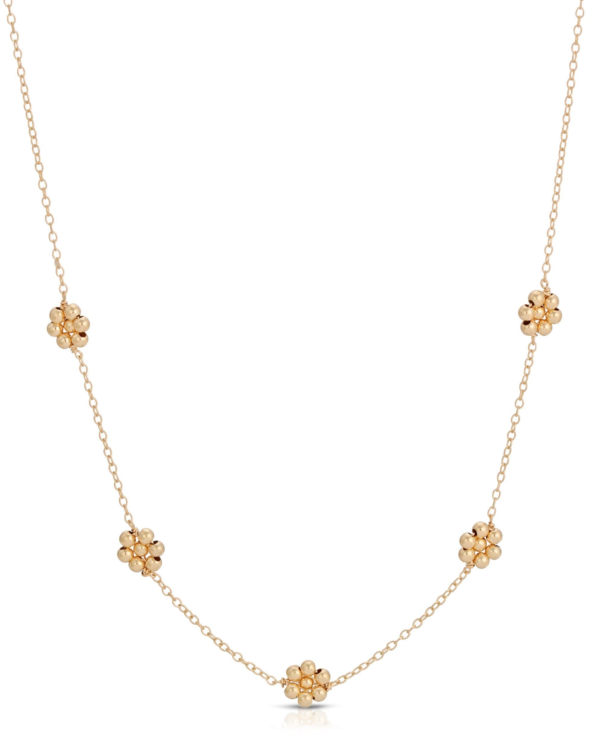 Florencia Necklace by KOZAKH. A 16 to 18 inch adjustable length necklace in 14K Gold Filled, featuring handmade gold beaded daisies.