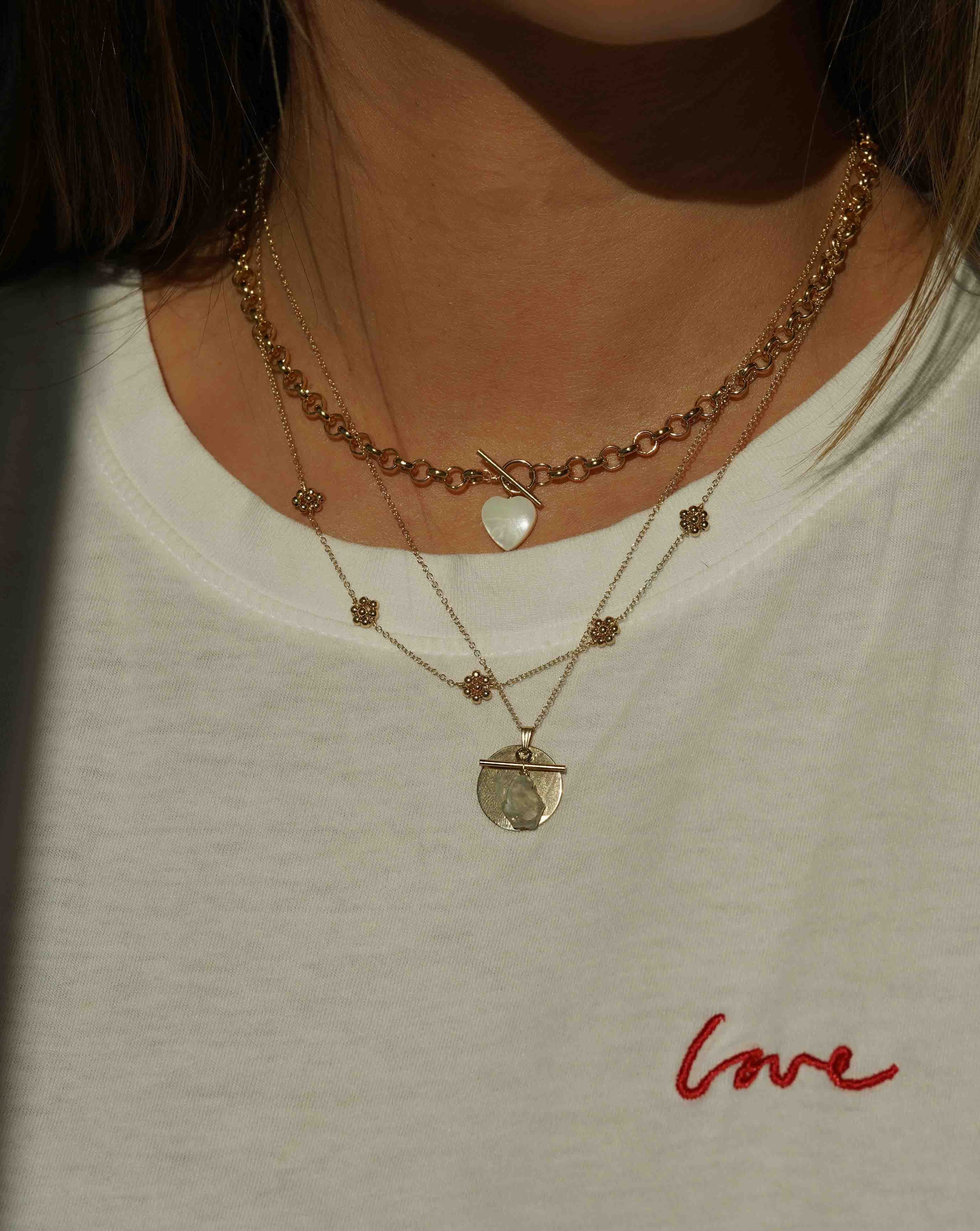 Florencia Necklace by KOZAKH. A 16 to 18 inch adjustable length necklace in 14K Gold Filled, featuring handmade gold beaded daisies.