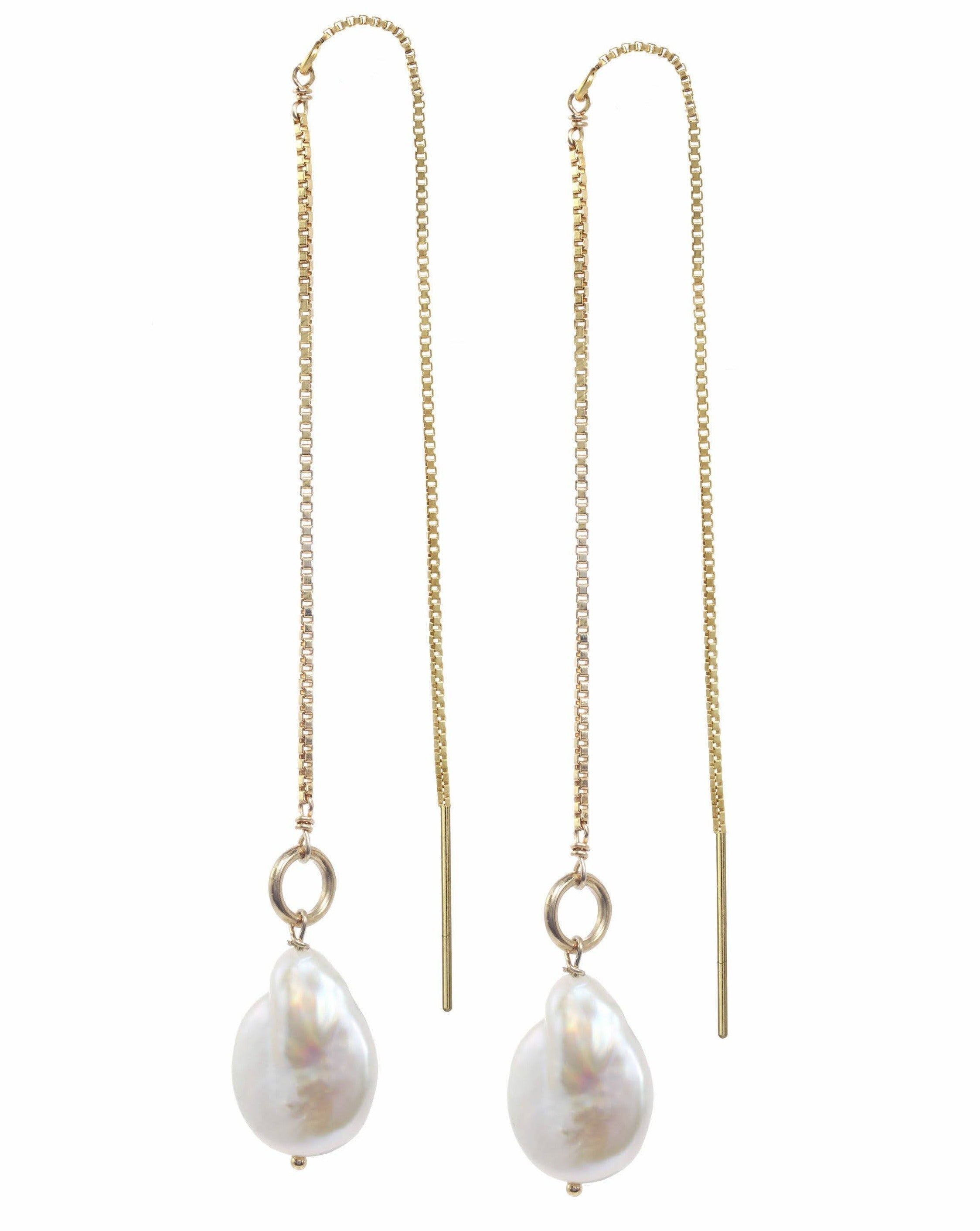 Genesis Threaders by KOZAKH. Threader style earrings with drop length of 2 inches on both sides, crafted in 14K Gold Filled, featuring Baroque Pearls.