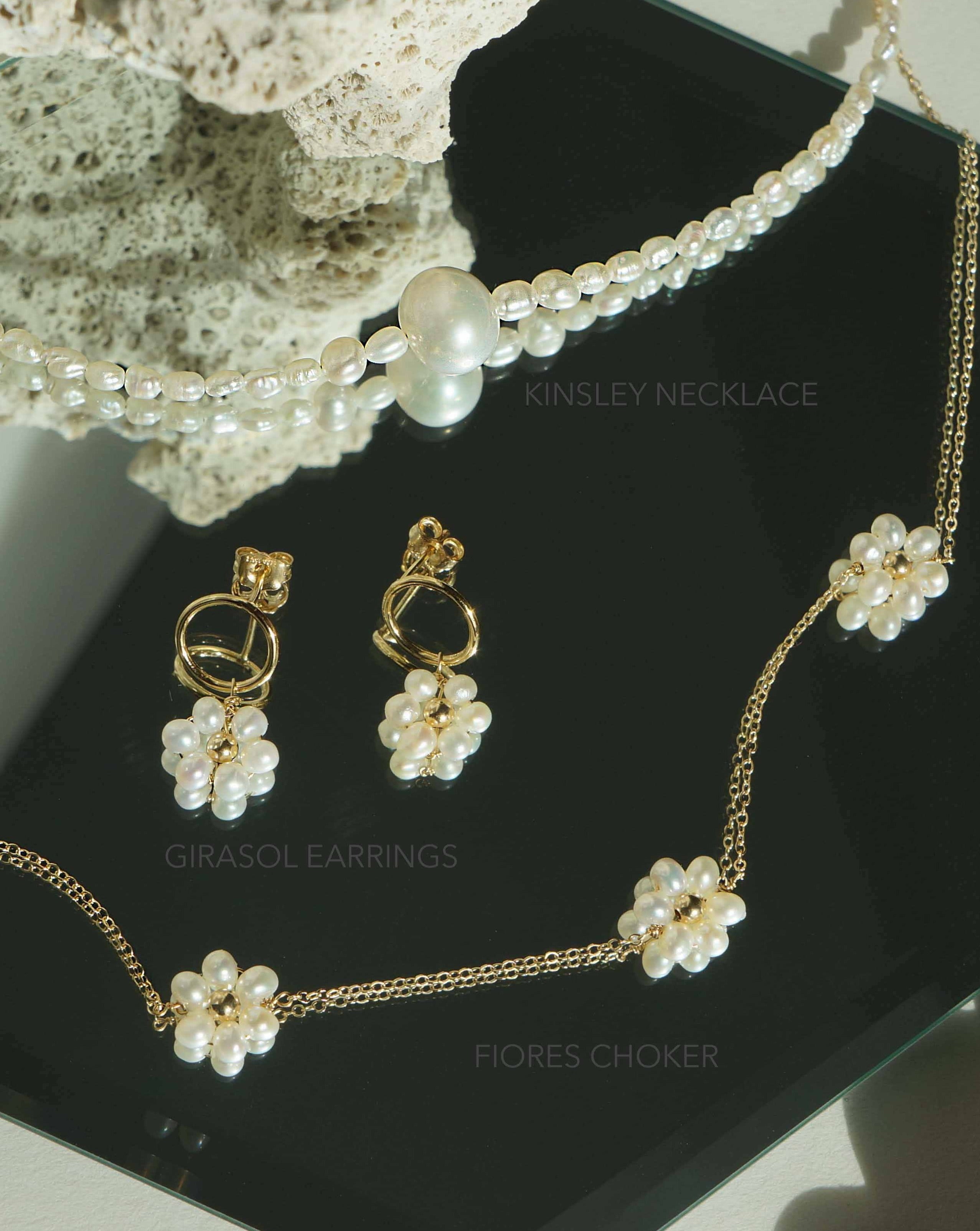 Girasol Earrings by KOZAKH. 10mm circle studs, crafted in 14K Gold Filled, featuring 3-4mm round freshwater Pearls forming a daisy.