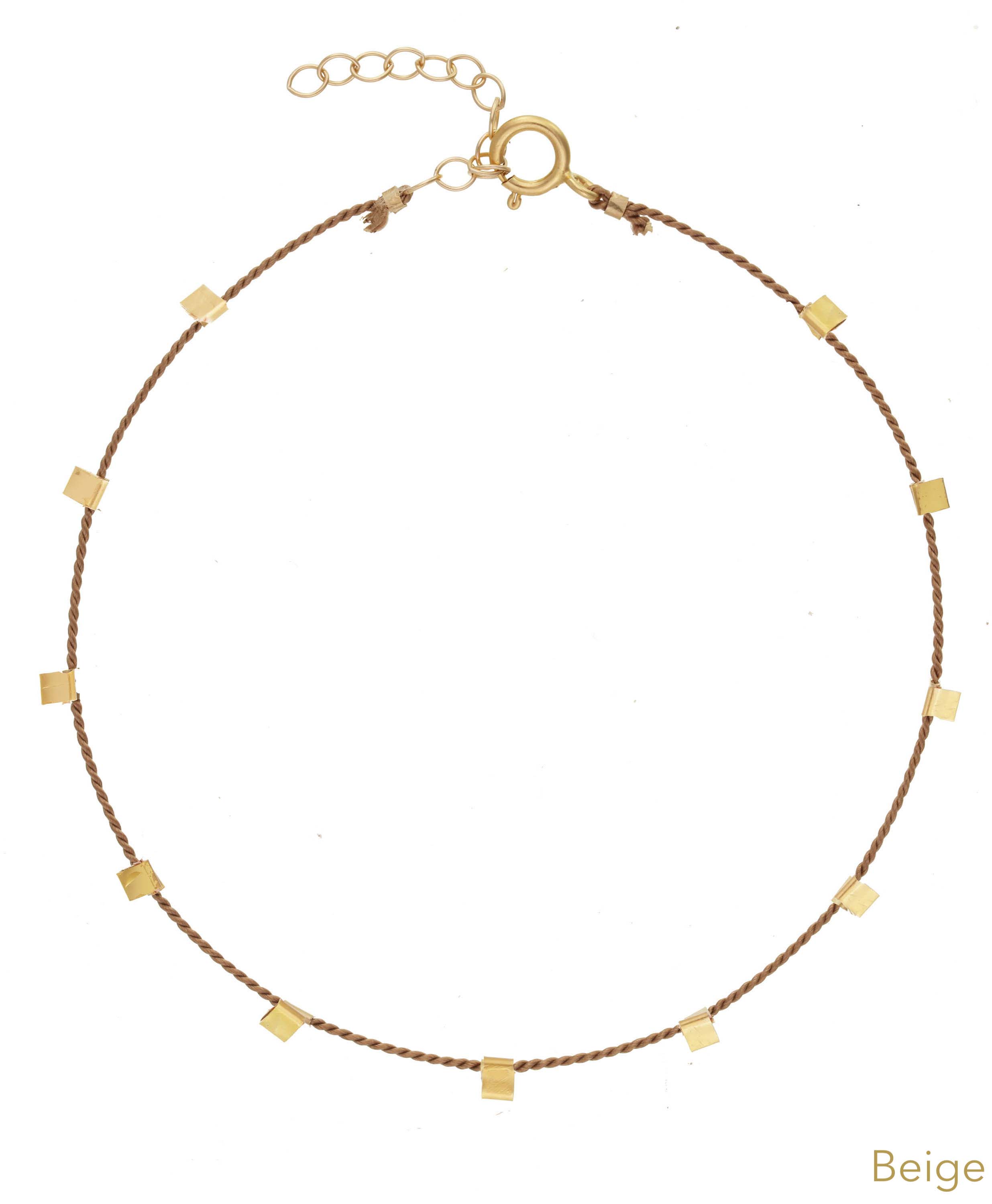 Hilo Bracelet by KOZAKH. A 6 to 7 inch adjustable length natural silk thread bracelet, embellished with 14K Gold Filled metals.