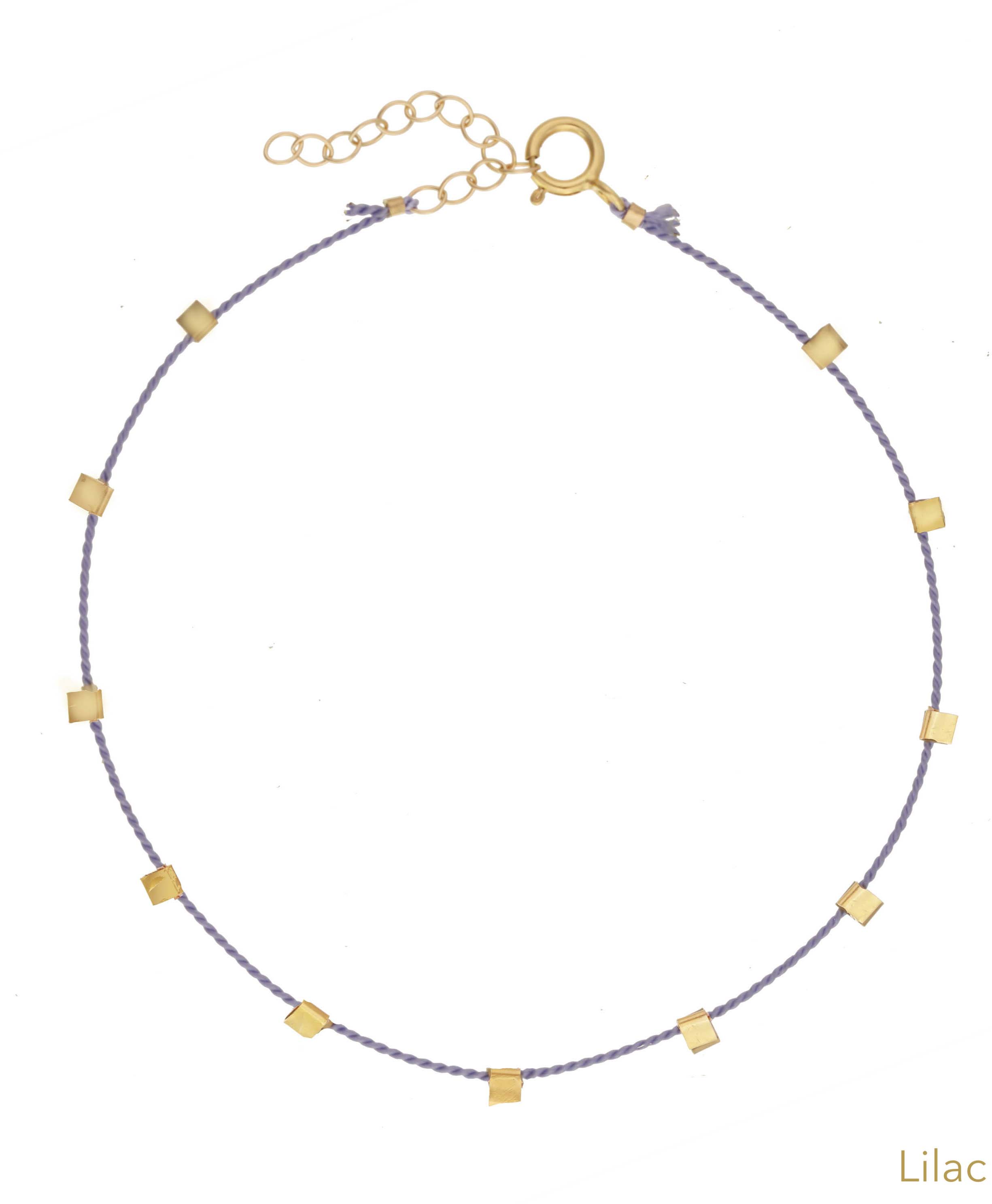 Hilo Bracelet by KOZAKH. A 6 to 7 inch adjustable length natural silk thread bracelet, embellished with 14K Gold Filled metals.