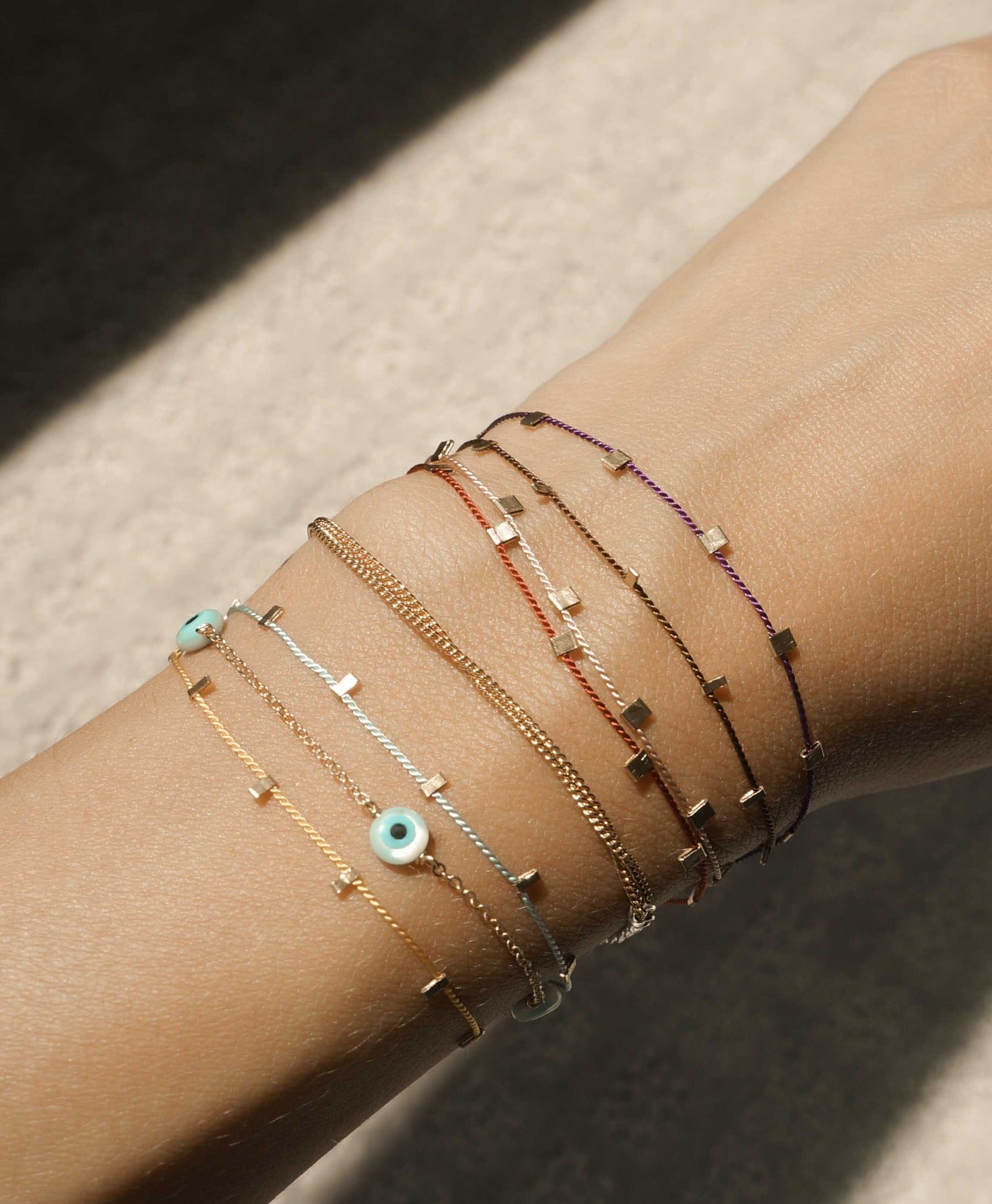 Hilo Bracelet by KOZAKH. A 6 to 7 inch adjustable length natural silk thread bracelet, embellished with 14K Gold Filled metals.