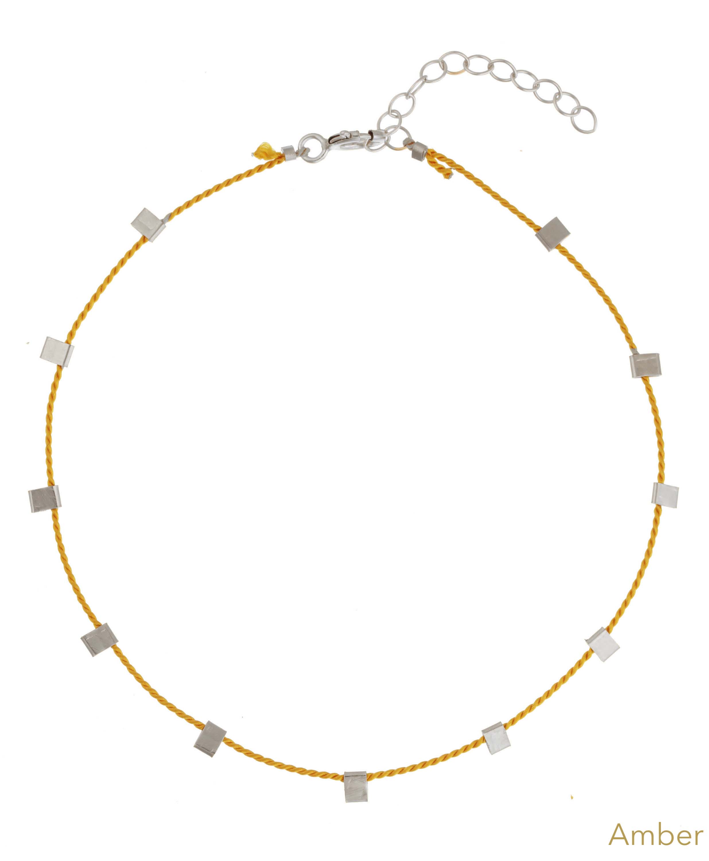 Hilo Bracelet by KOZAKH. A 6 to 7 inch adjustable length natural silk thread bracelet, embellished with Sterling Silver metals.