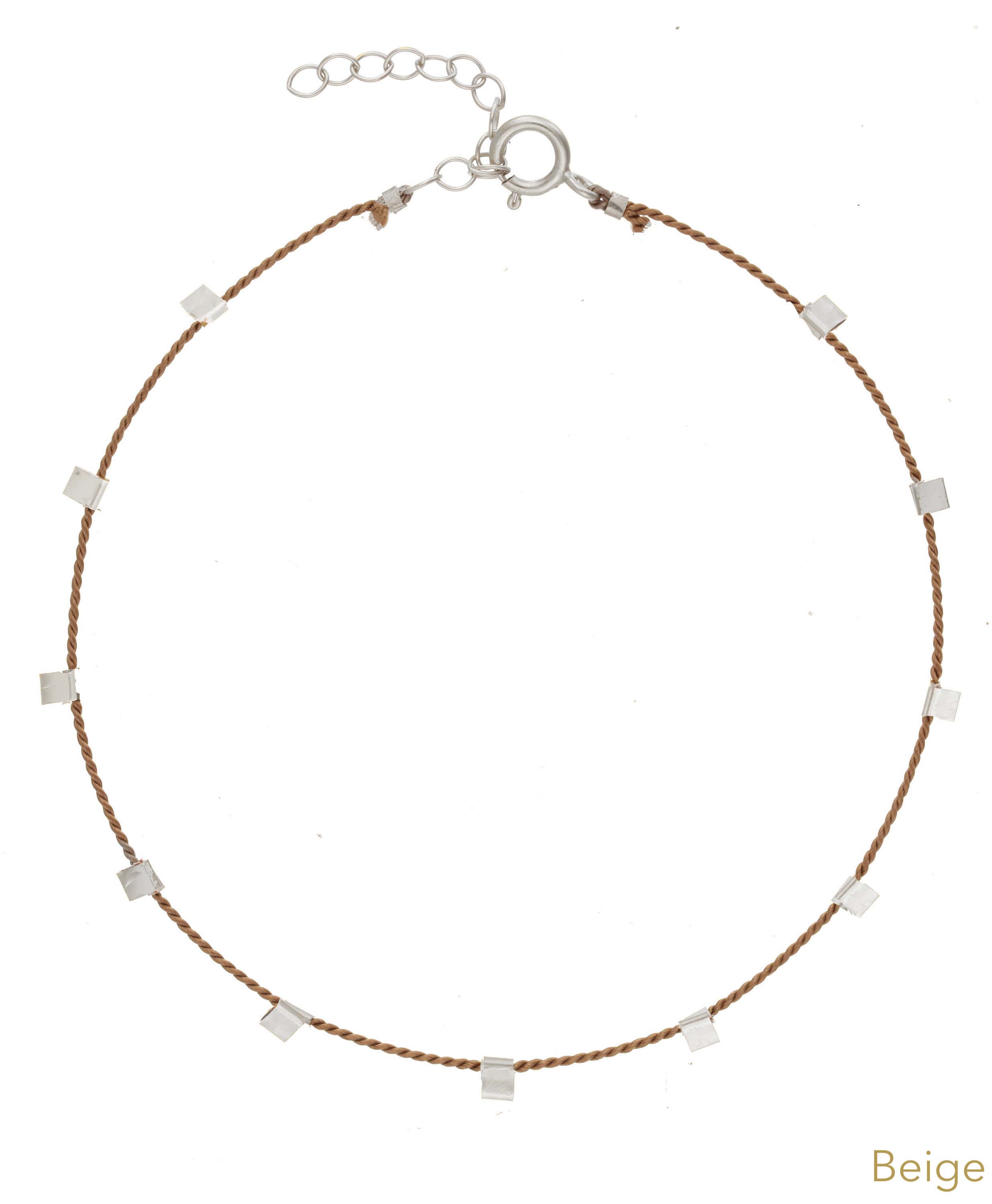 Hilo Bracelet by KOZAKH. A 6 to 7 inch adjustable length natural silk thread bracelet, embellished with Sterling Silver metals.