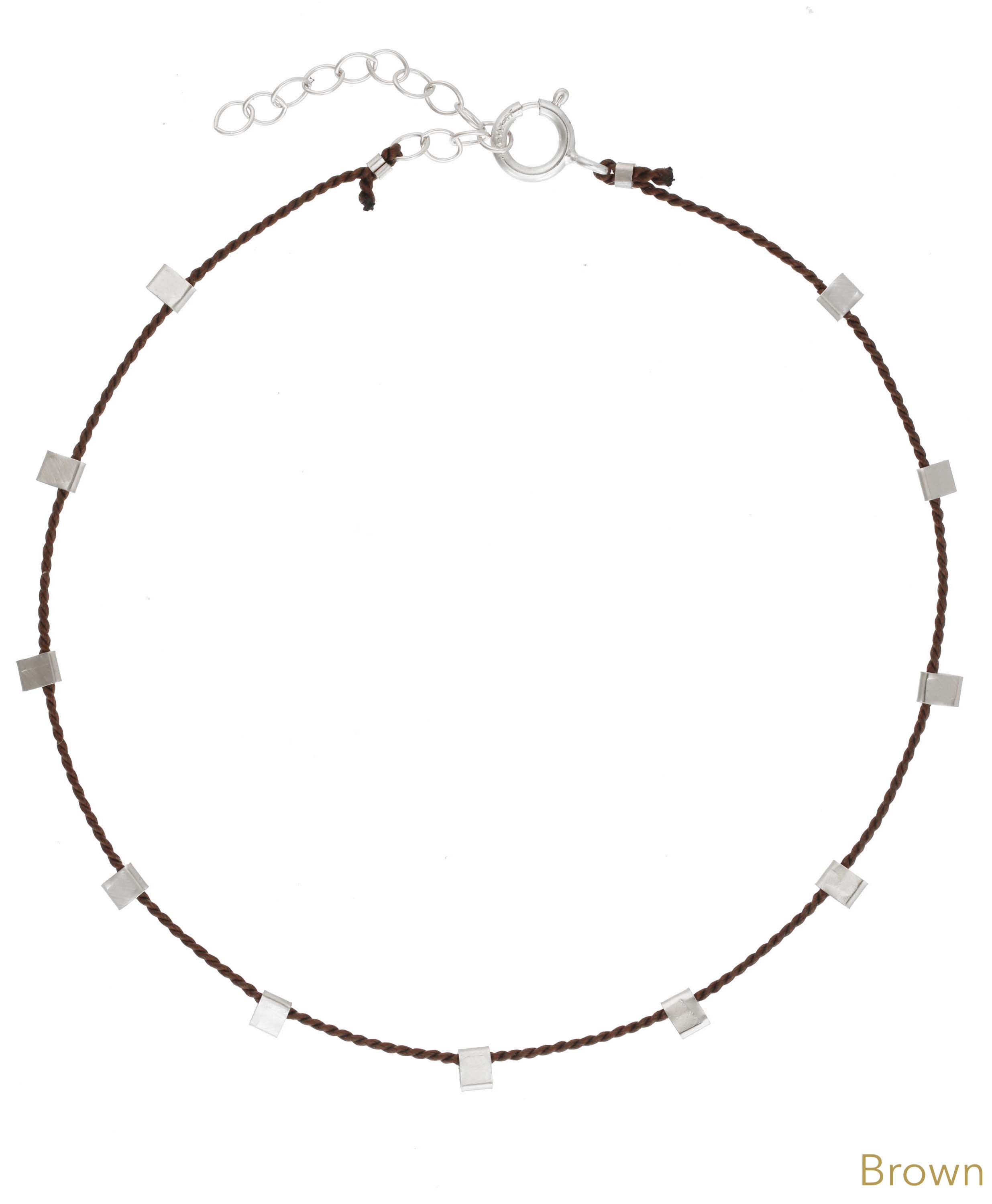 Hilo Bracelet by KOZAKH. A 6 to 7 inch adjustable length natural silk thread bracelet, embellished with Sterling Silver metals.