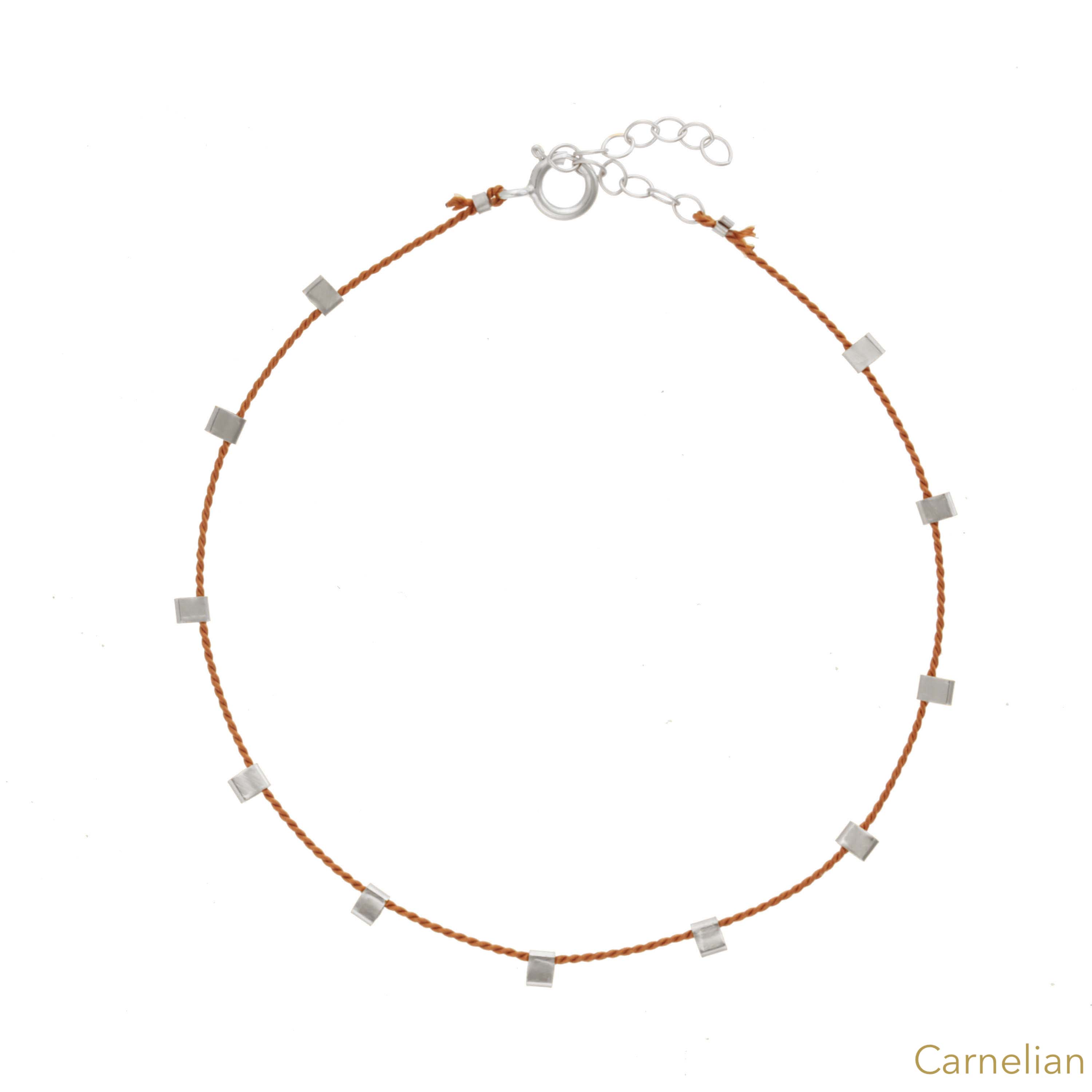 Hilo Bracelet by KOZAKH. A 6 to 7 inch adjustable length natural silk thread bracelet, embellished with Sterling Silver metals.