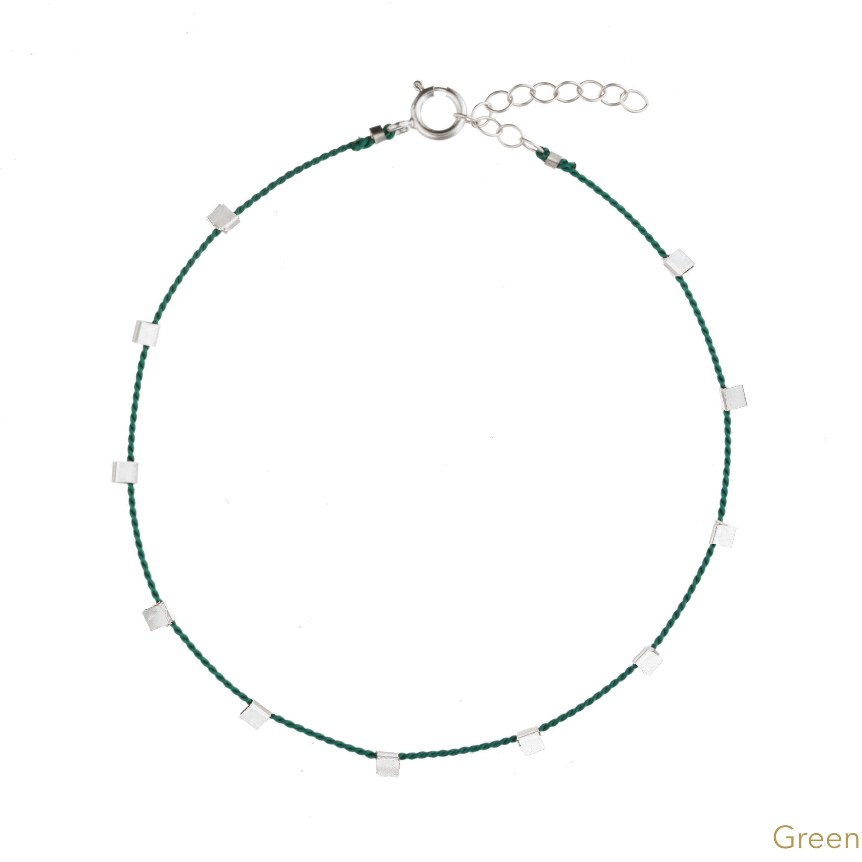 Hilo Bracelet by KOZAKH. A 6 to 7 inch adjustable length natural silk thread bracelet, embellished with Sterling Silver metals.