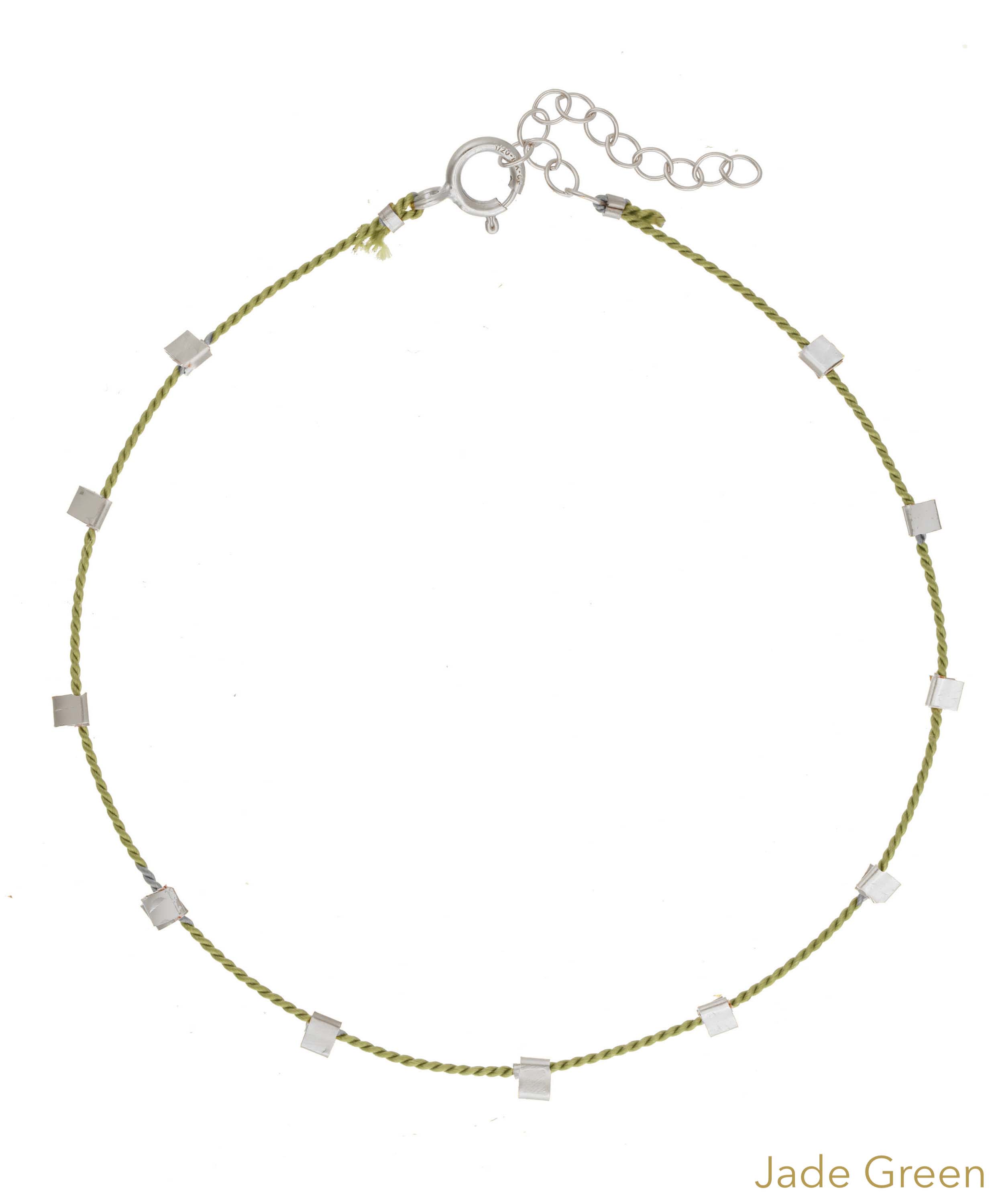 Hilo Bracelet by KOZAKH. A 6 to 7 inch adjustable length natural silk thread bracelet, embellished with Sterling Silver metals.