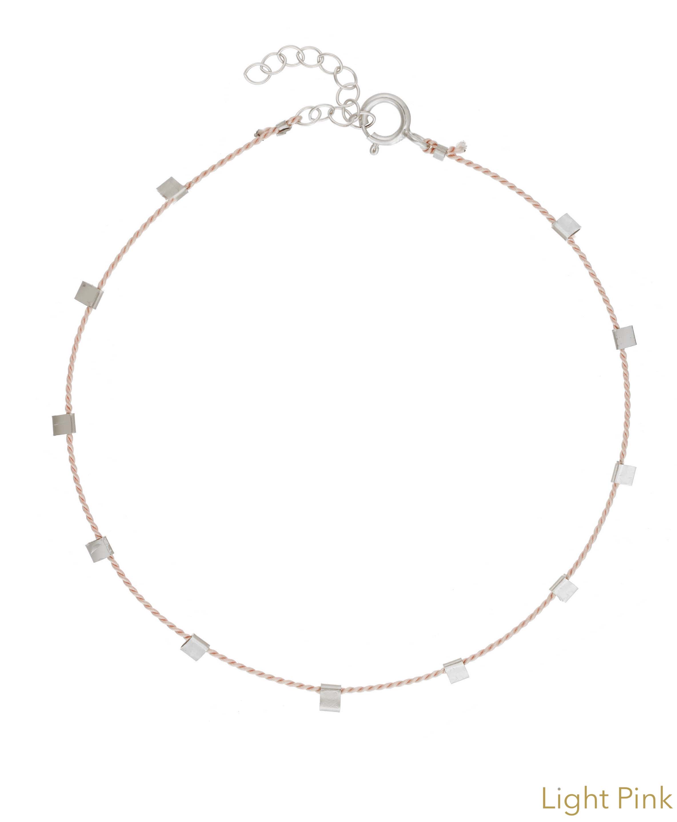 Hilo Bracelet by KOZAKH. A 6 to 7 inch adjustable length natural silk thread bracelet, embellished with Sterling Silver metals.