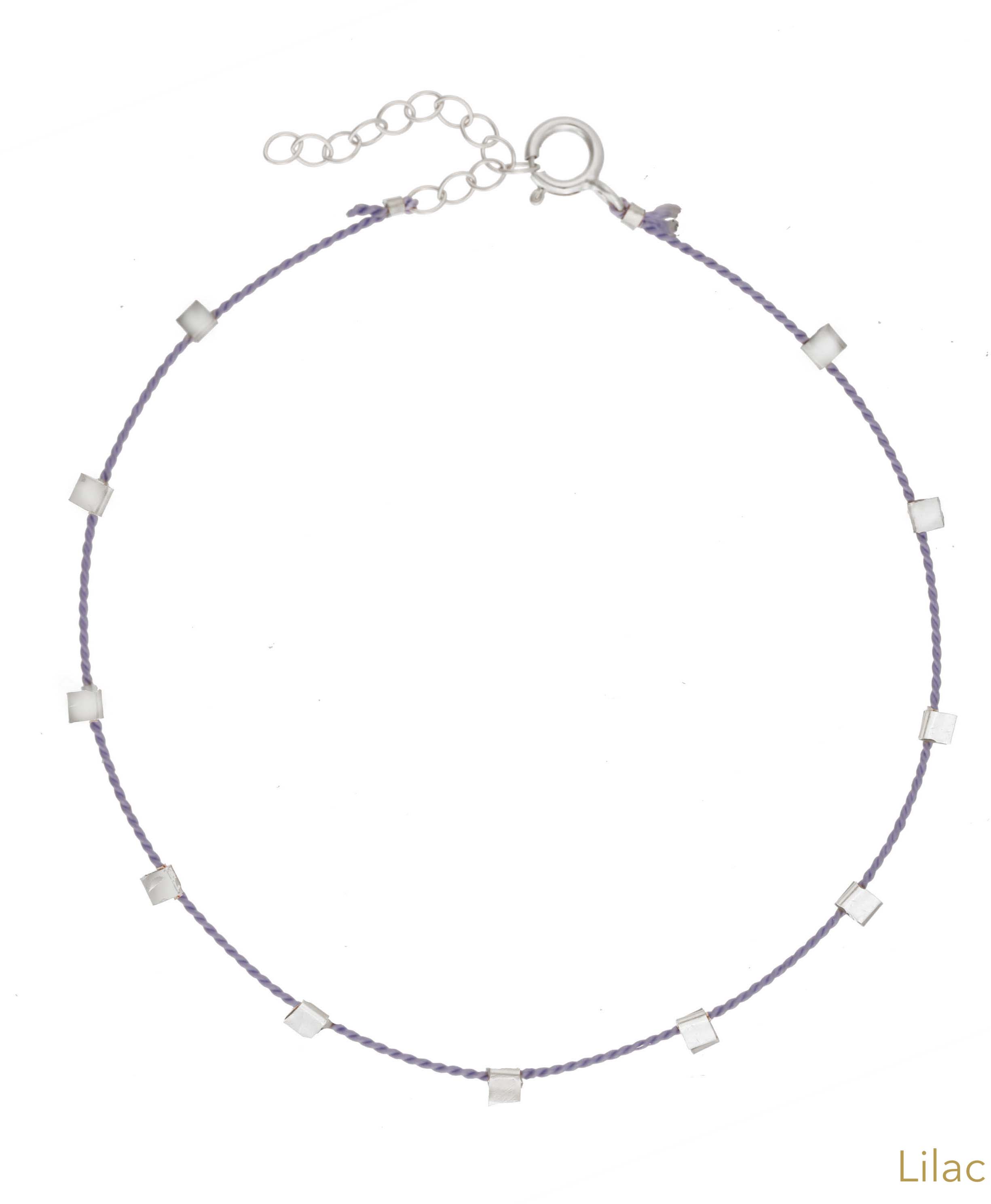 Hilo Bracelet by KOZAKH. A 6 to 7 inch adjustable length natural silk thread bracelet, embellished with Sterling Silver metals.