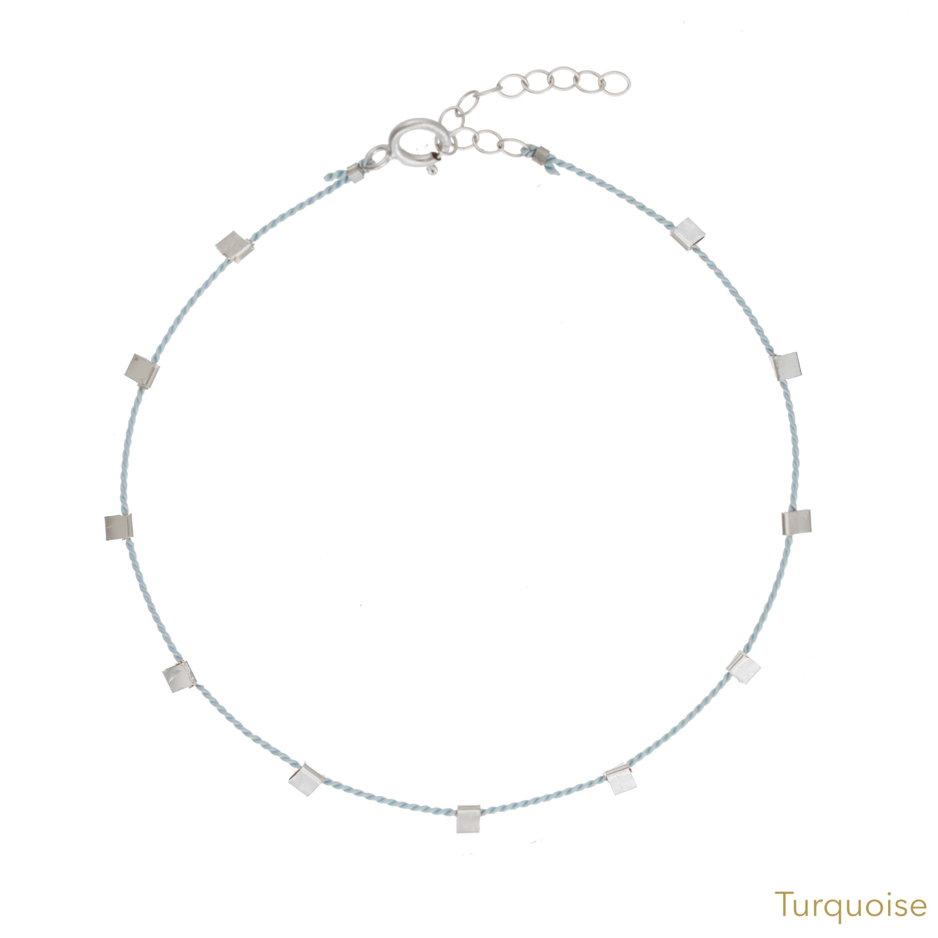 Hilo Bracelet by KOZAKH. A 6 to 7 inch adjustable length natural silk thread bracelet, embellished with Sterling Silver metals.