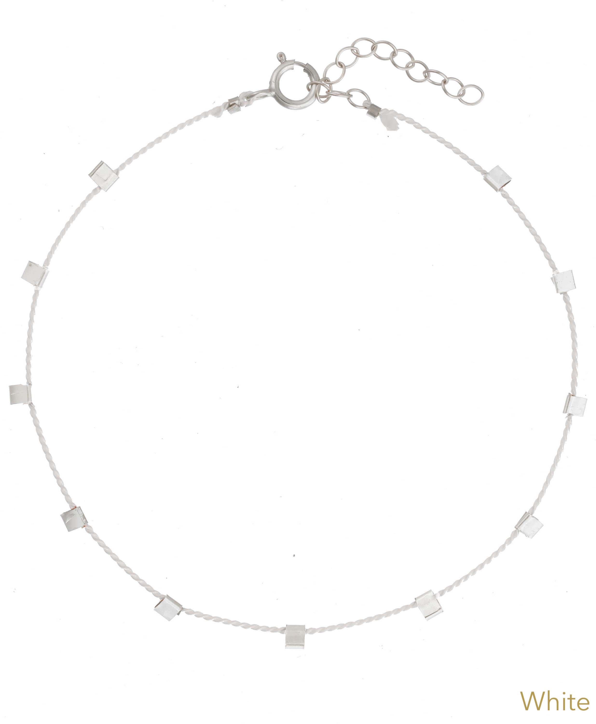 Hilo Bracelet by KOZAKH. A 6 to 7 inch adjustable length natural silk thread bracelet, embellished with Sterling Silver metals.