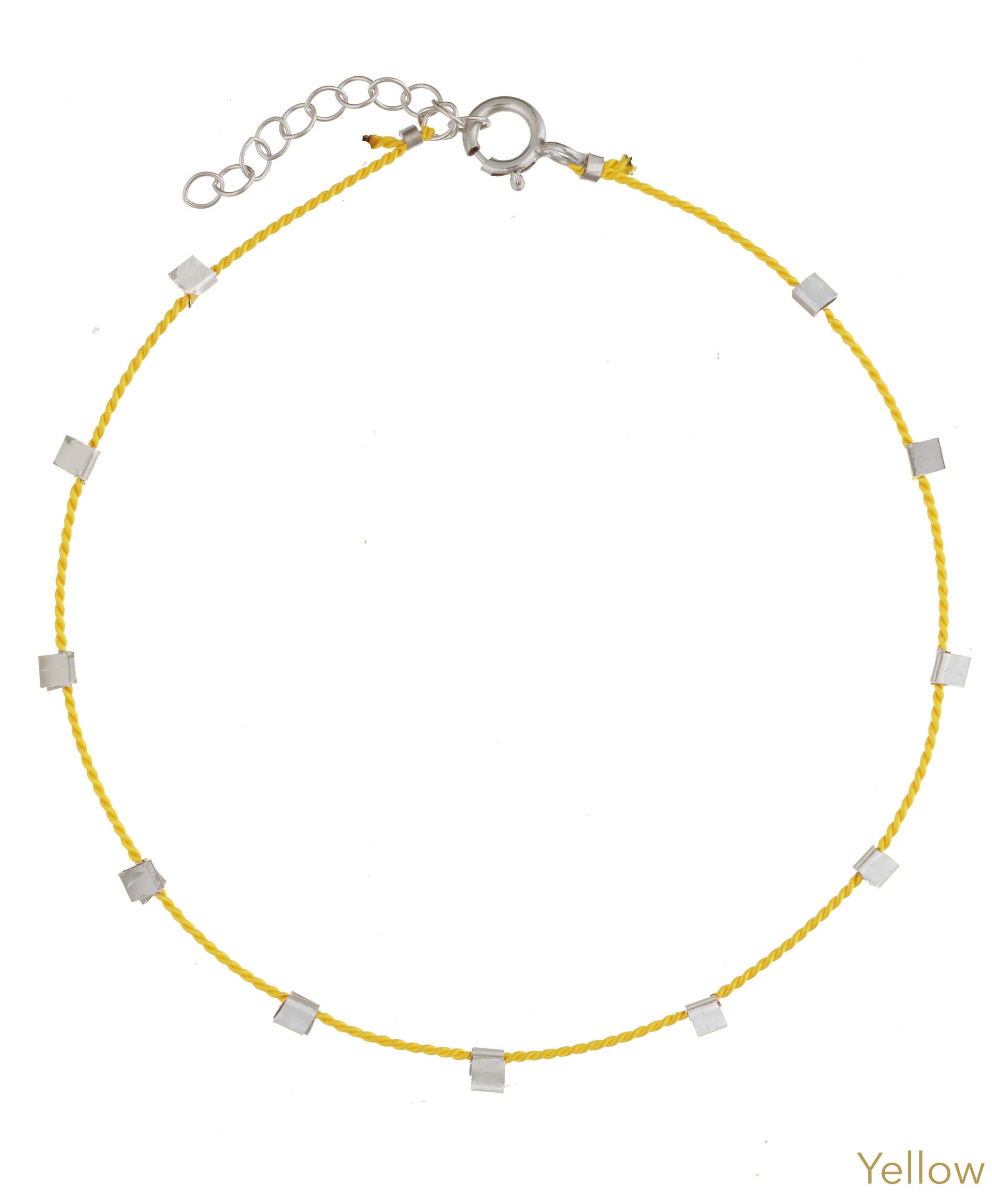 Hilo Bracelet by KOZAKH. A 6 to 7 inch adjustable length natural silk thread bracelet, embellished with Sterling Silver metals.