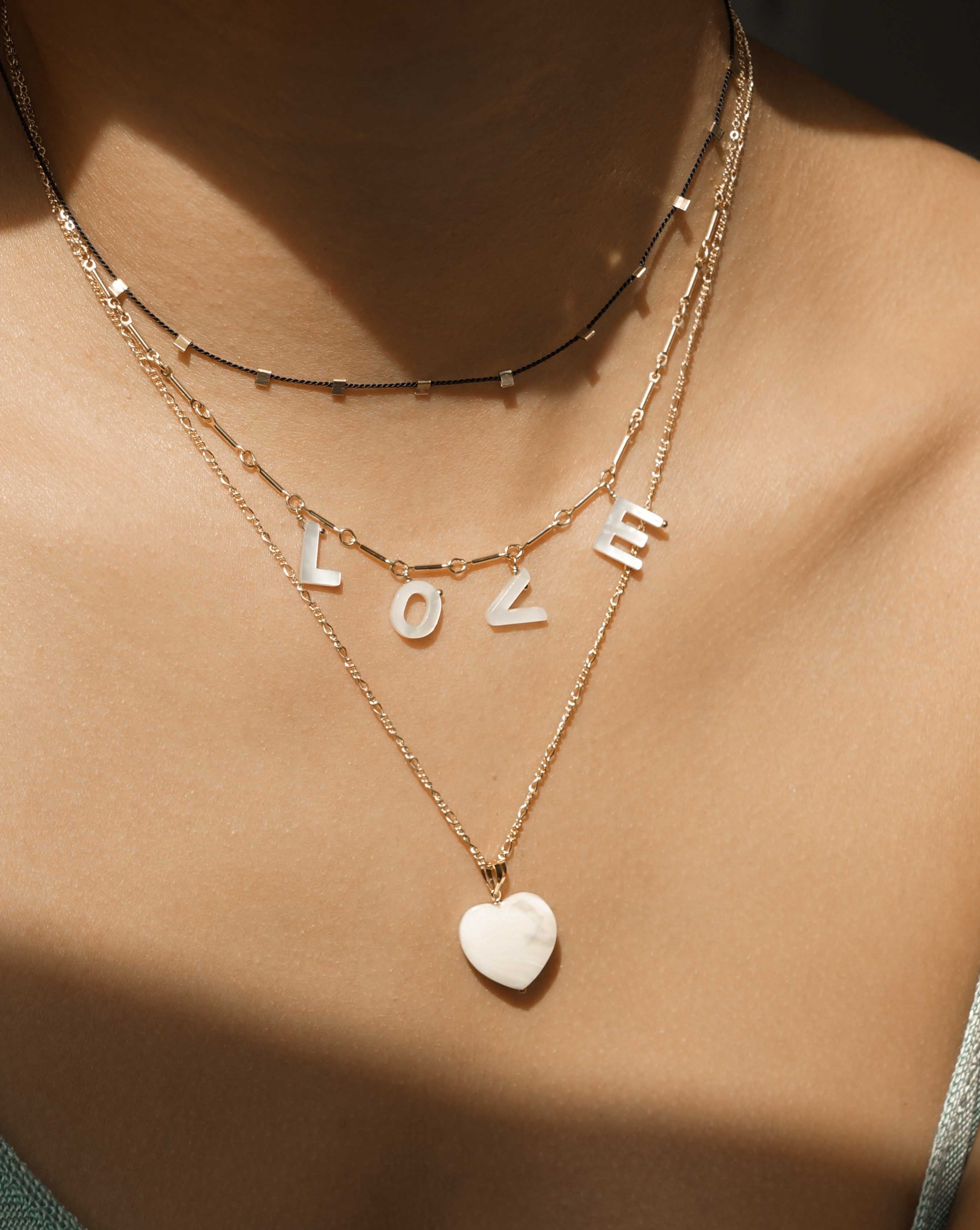 Hilo Necklace by KOZAKH. A 16 inch long natural silk thread necklace, embellished with 14K Gold Filled square cut metals.