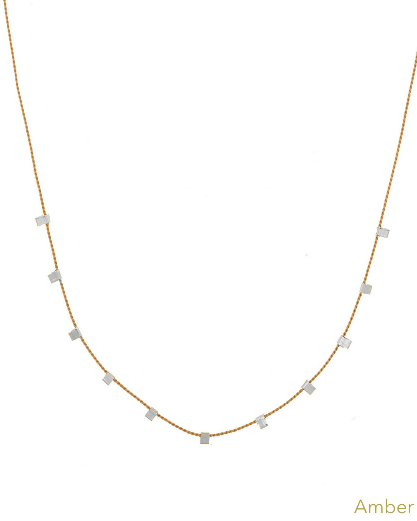 Hilo Necklace by KOZAKH. A 16 inch long natural silk thread necklace, embellished with Sterling Silver square cut metals.