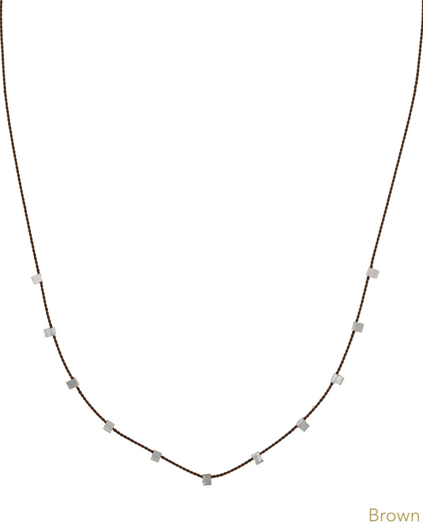 Hilo Necklace by KOZAKH. A 16 inch long natural silk thread necklace, embellished with Sterling Silver square cut metals.
