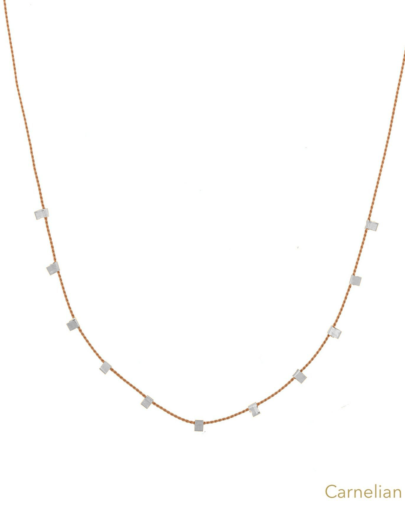Hilo Necklace by KOZAKH. A 16 inch long natural silk thread necklace, embellished with Sterling Silver square cut metals.