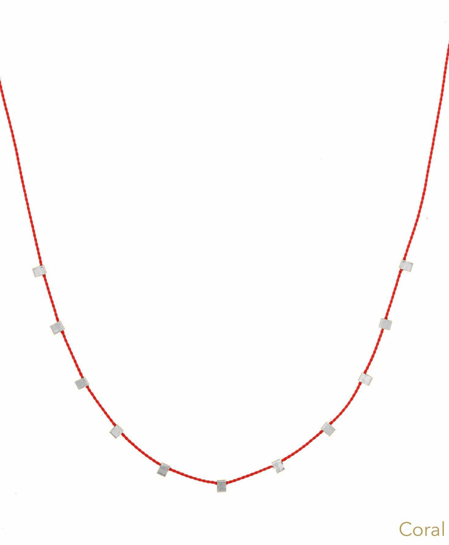 Hilo Necklace by KOZAKH. A 16 inch long natural silk thread necklace, embellished with Sterling Silver square cut metals.