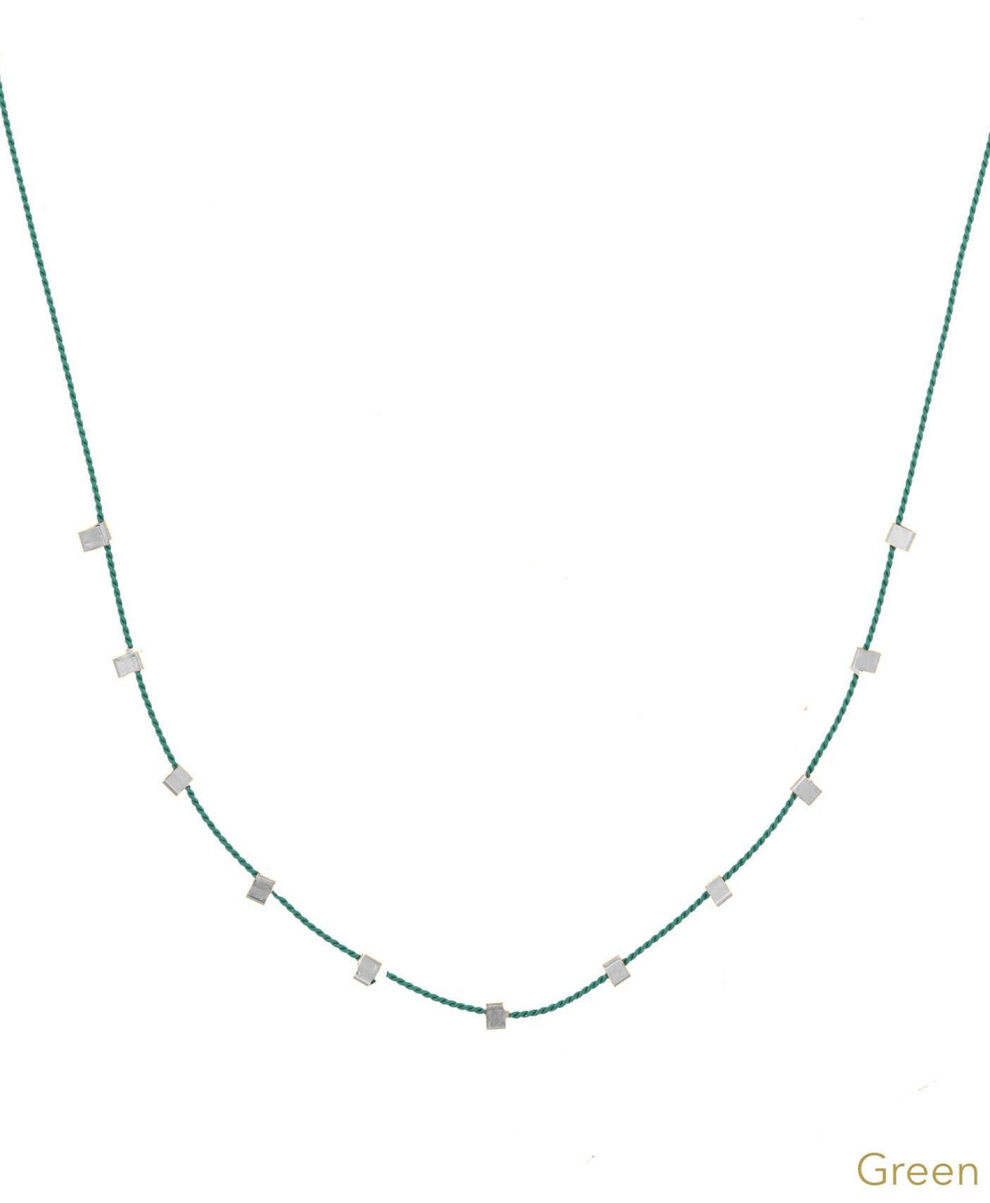 Hilo Necklace by KOZAKH. A 16 inch long natural silk thread necklace, embellished with Sterling Silver square cut metals.