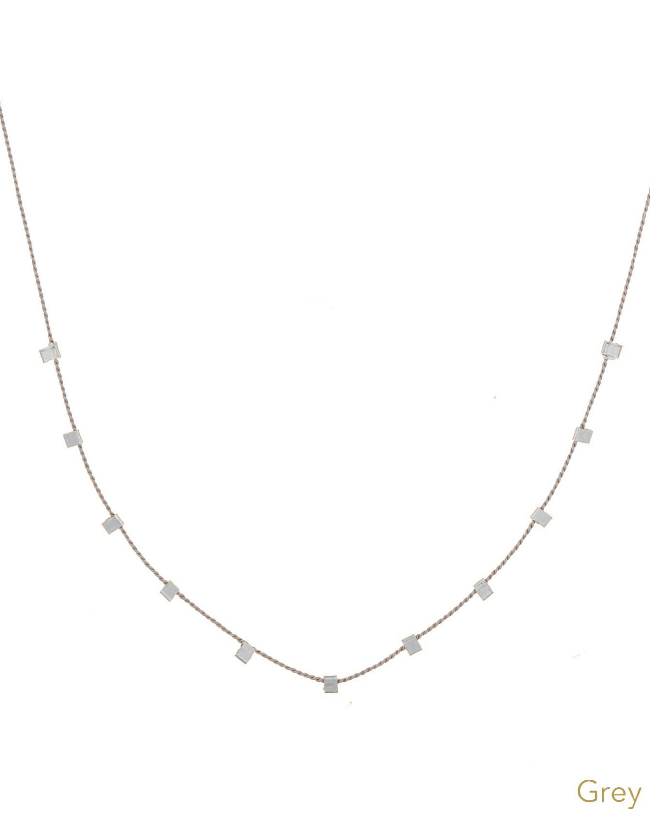 Hilo Necklace by KOZAKH. A 16 inch long natural silk thread necklace, embellished with Sterling Silver square cut metals.